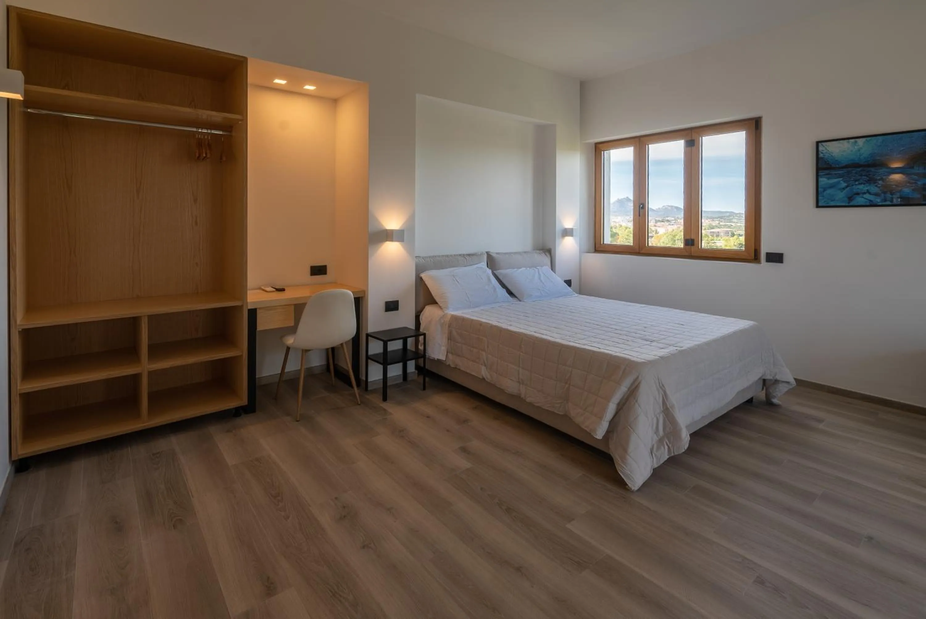 Bed in Antares Rooms and Suites