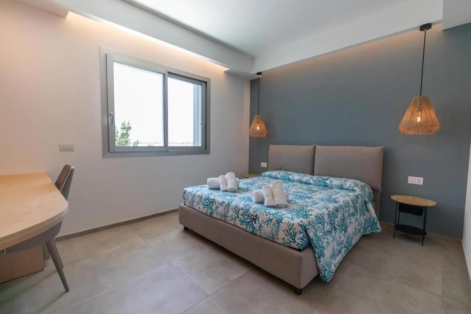 Bed in Antares Rooms and Suites