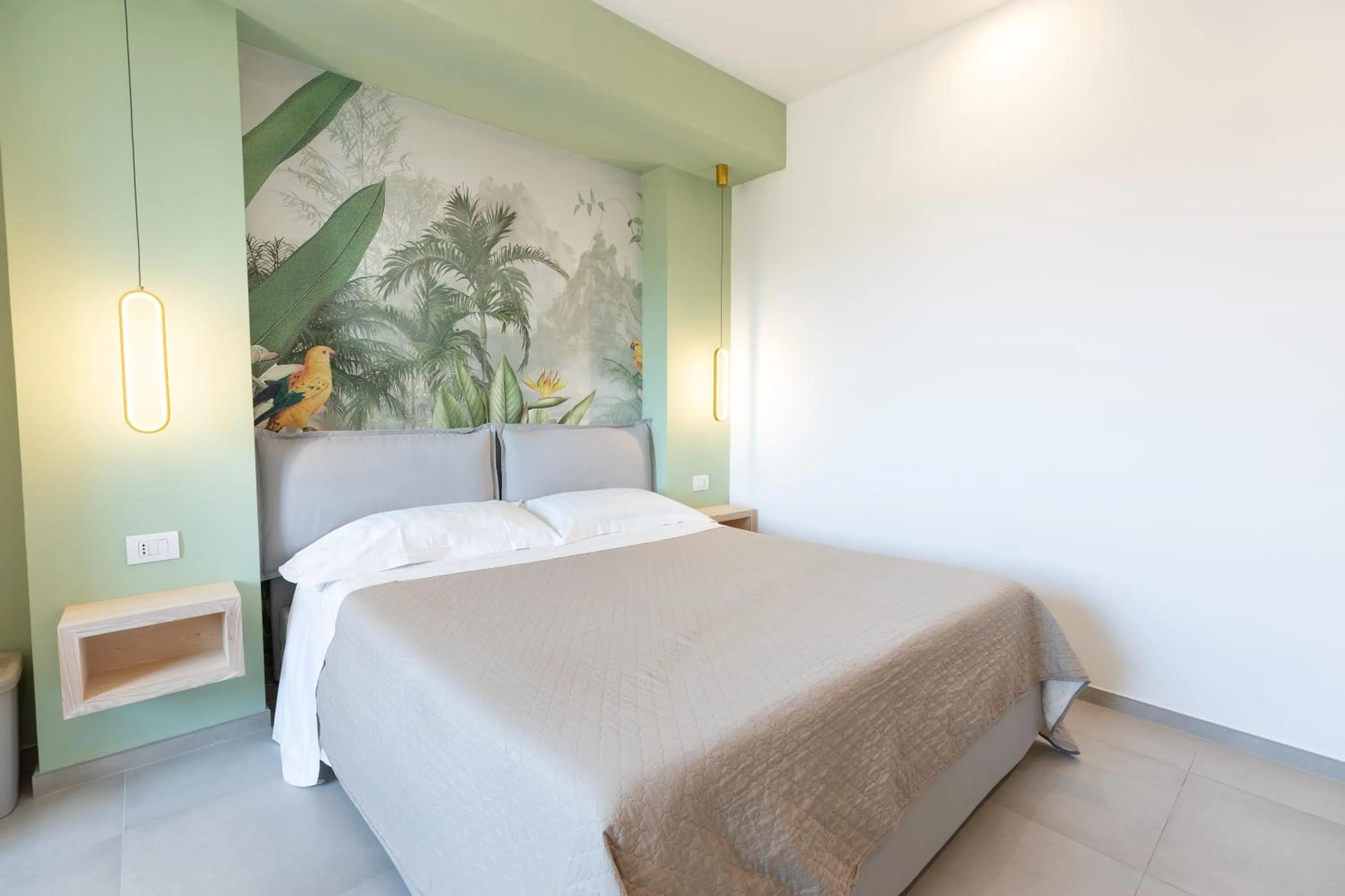 Bed in Antares Rooms and Suites