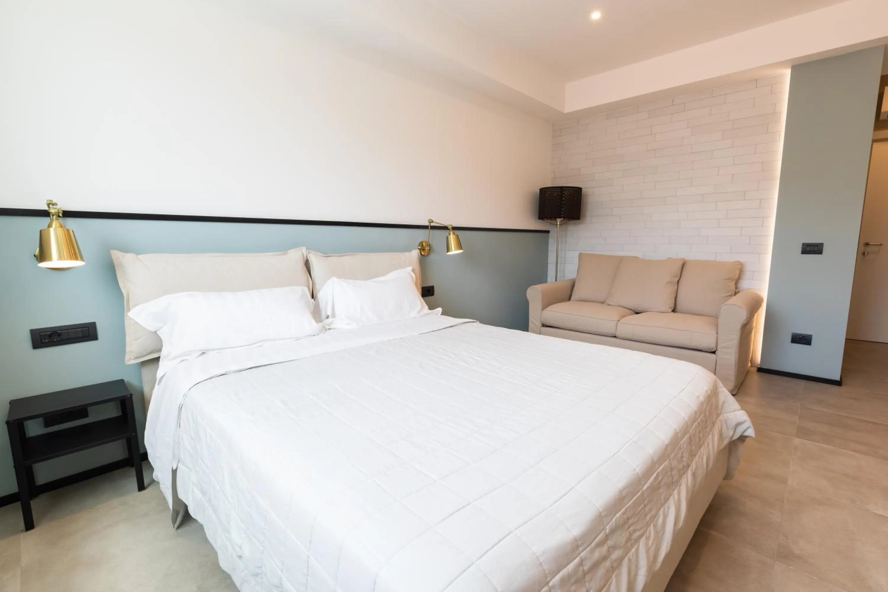 Bed in Antares Rooms and Suites