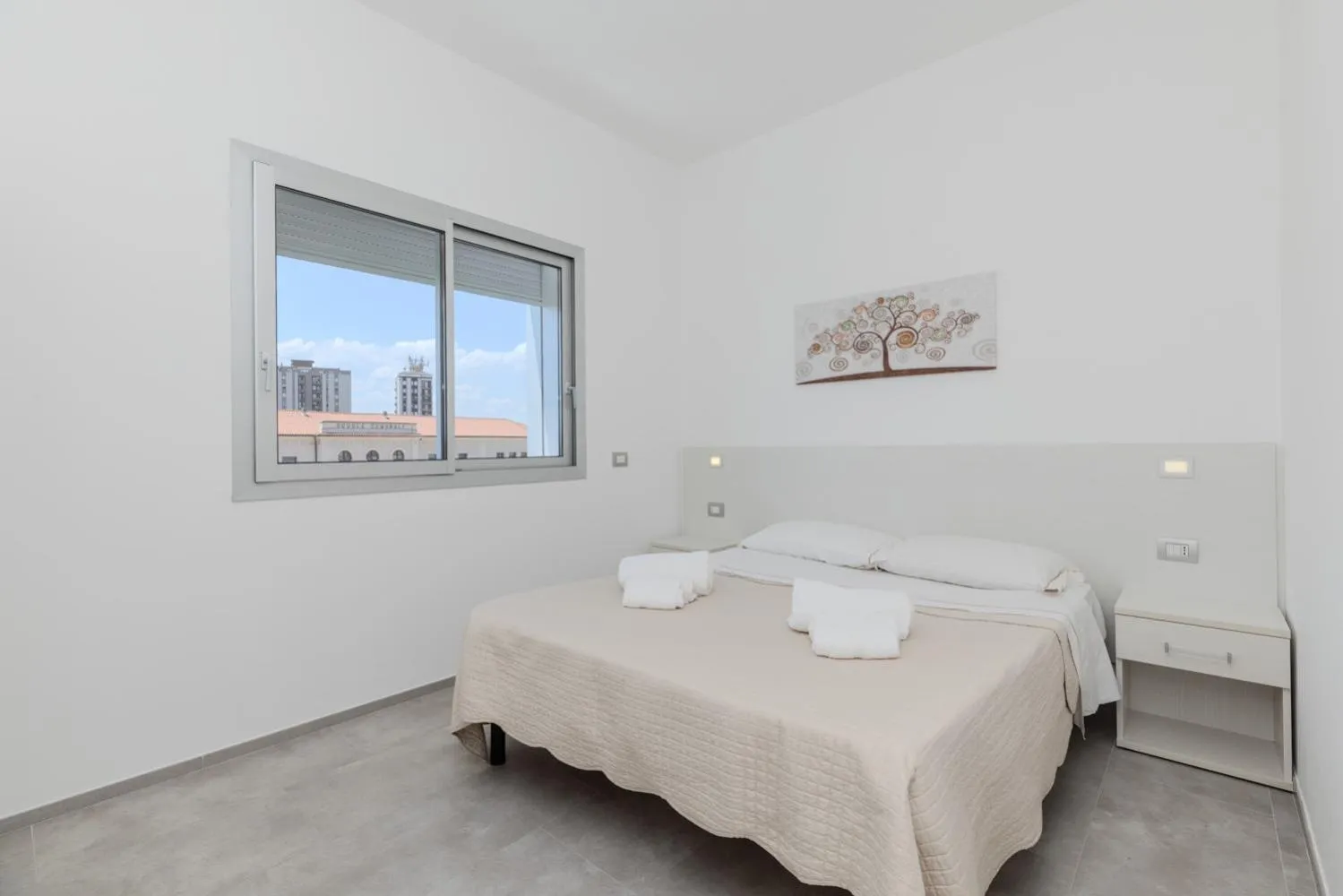 Bed in Antares Rooms and Suites