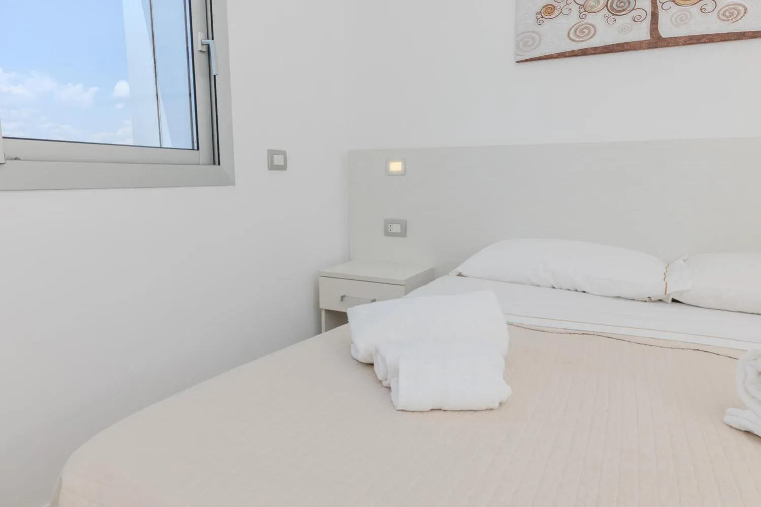 Bed in Antares Rooms and Suites