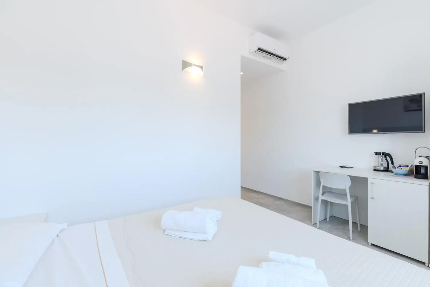 Bed in Antares Rooms and Suites