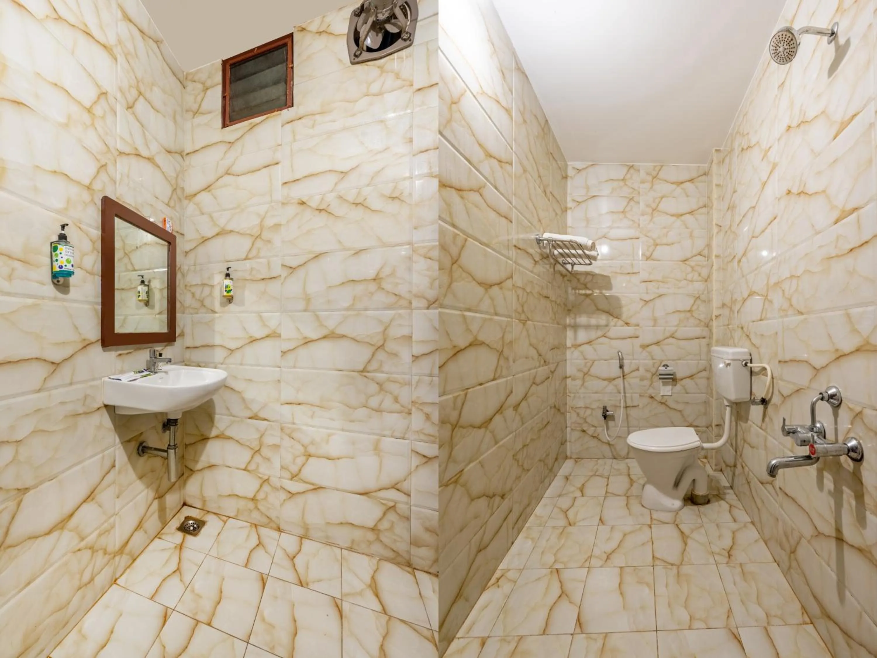 Bathroom in Treebo Grace Inn, 3 Min Walk From Promenade Beach