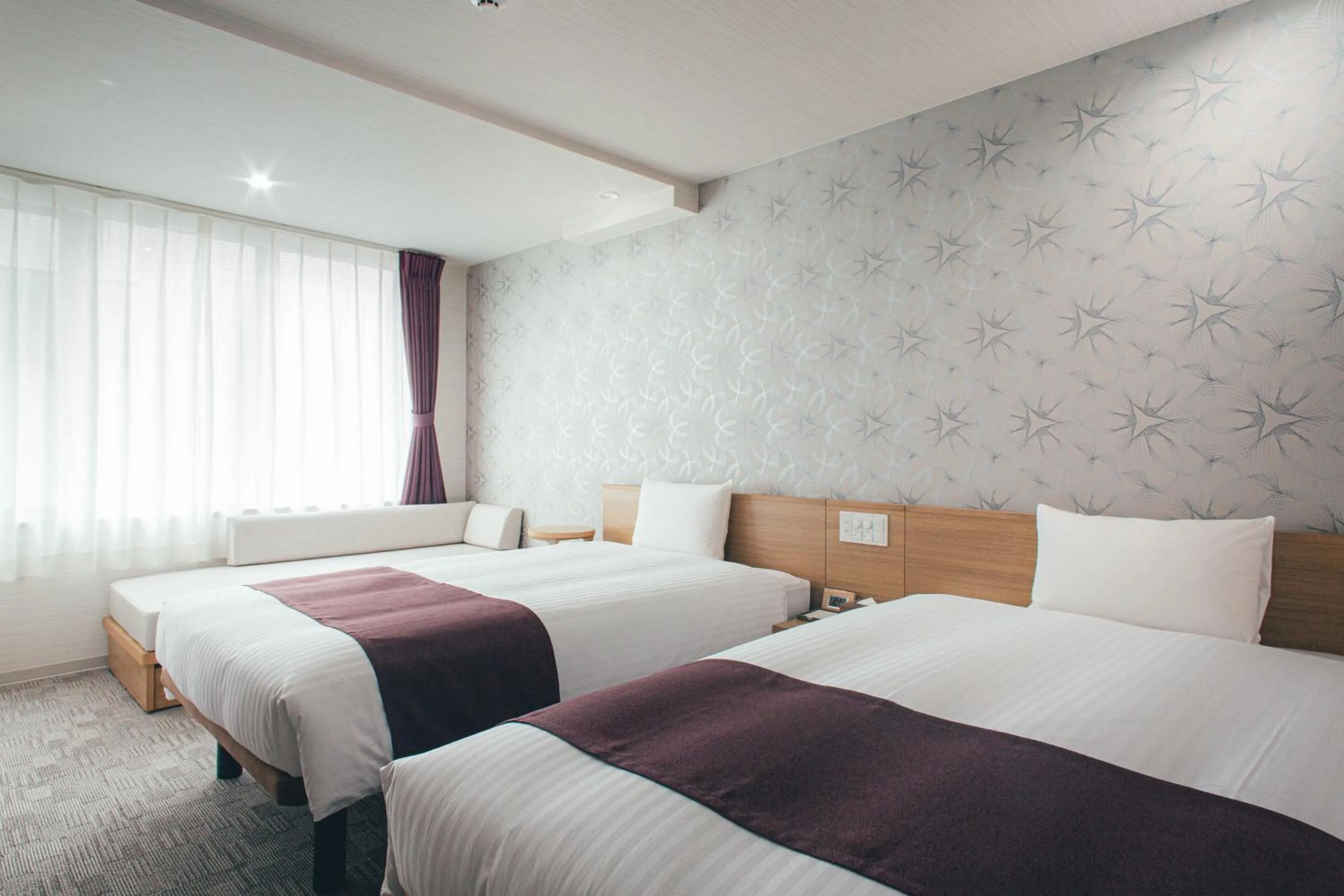 Bed in Kuretake Inn Okayama