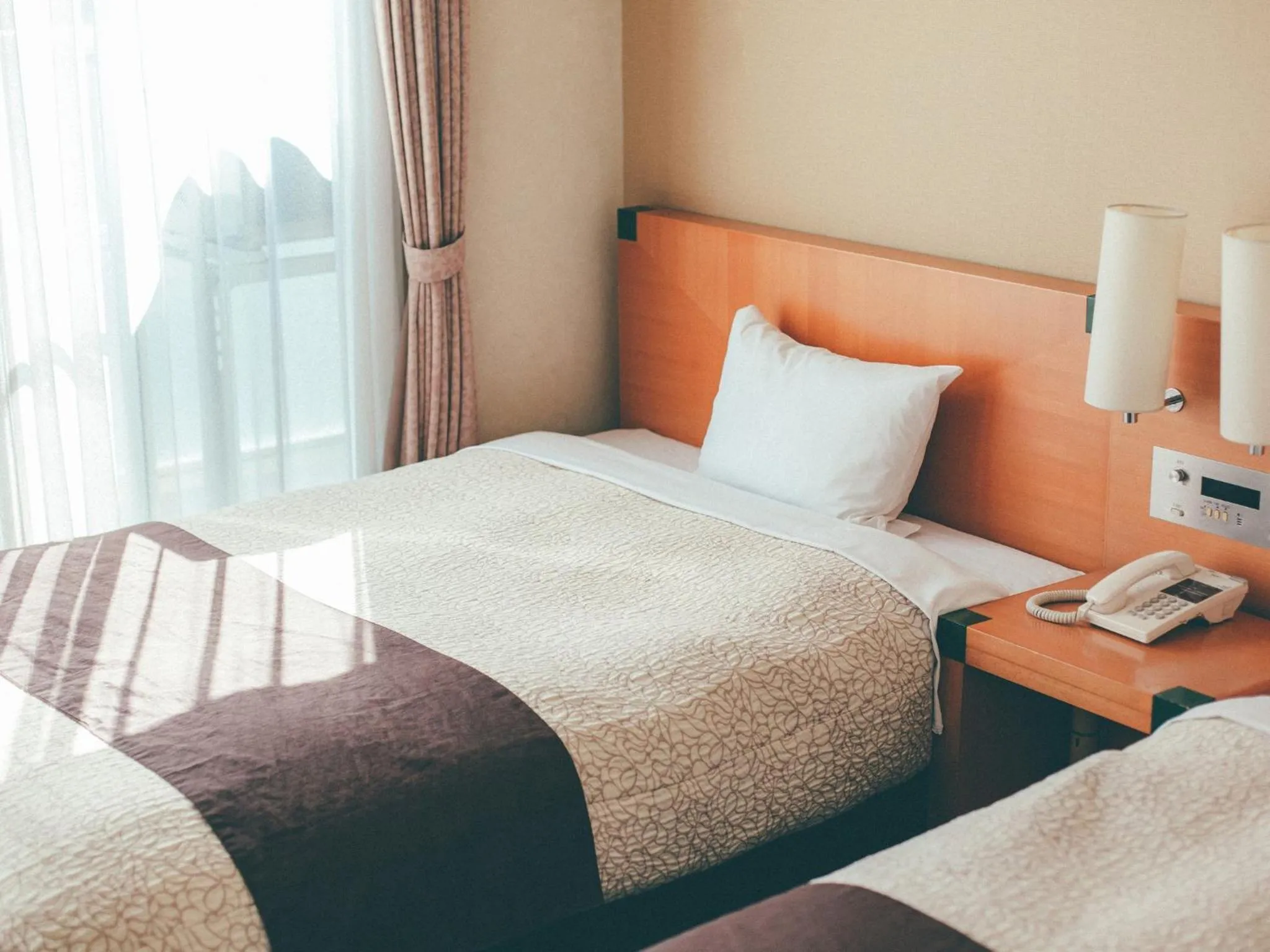 Bed in Kuretake Inn Okayama