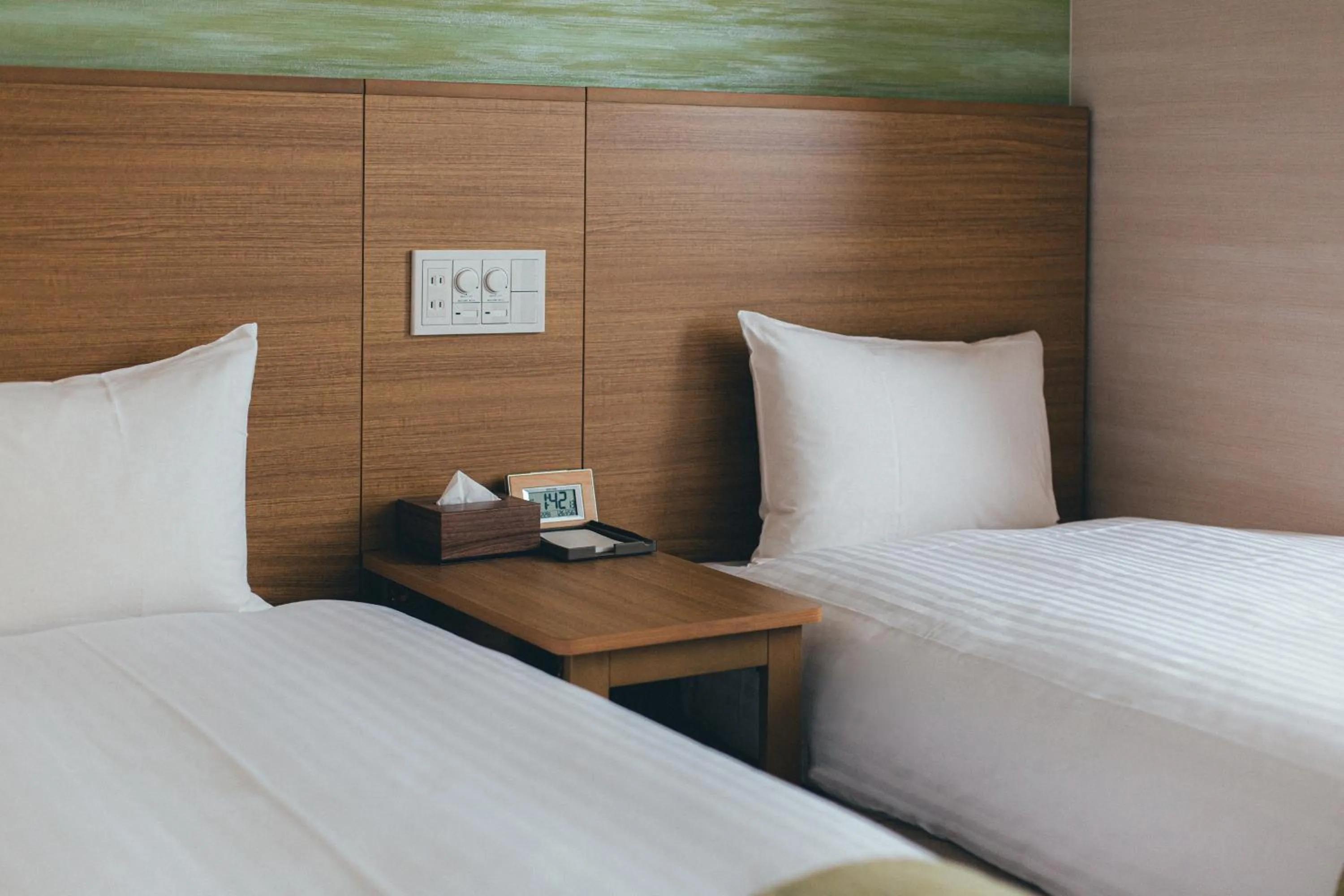 Bed in Kuretake Inn Okayama