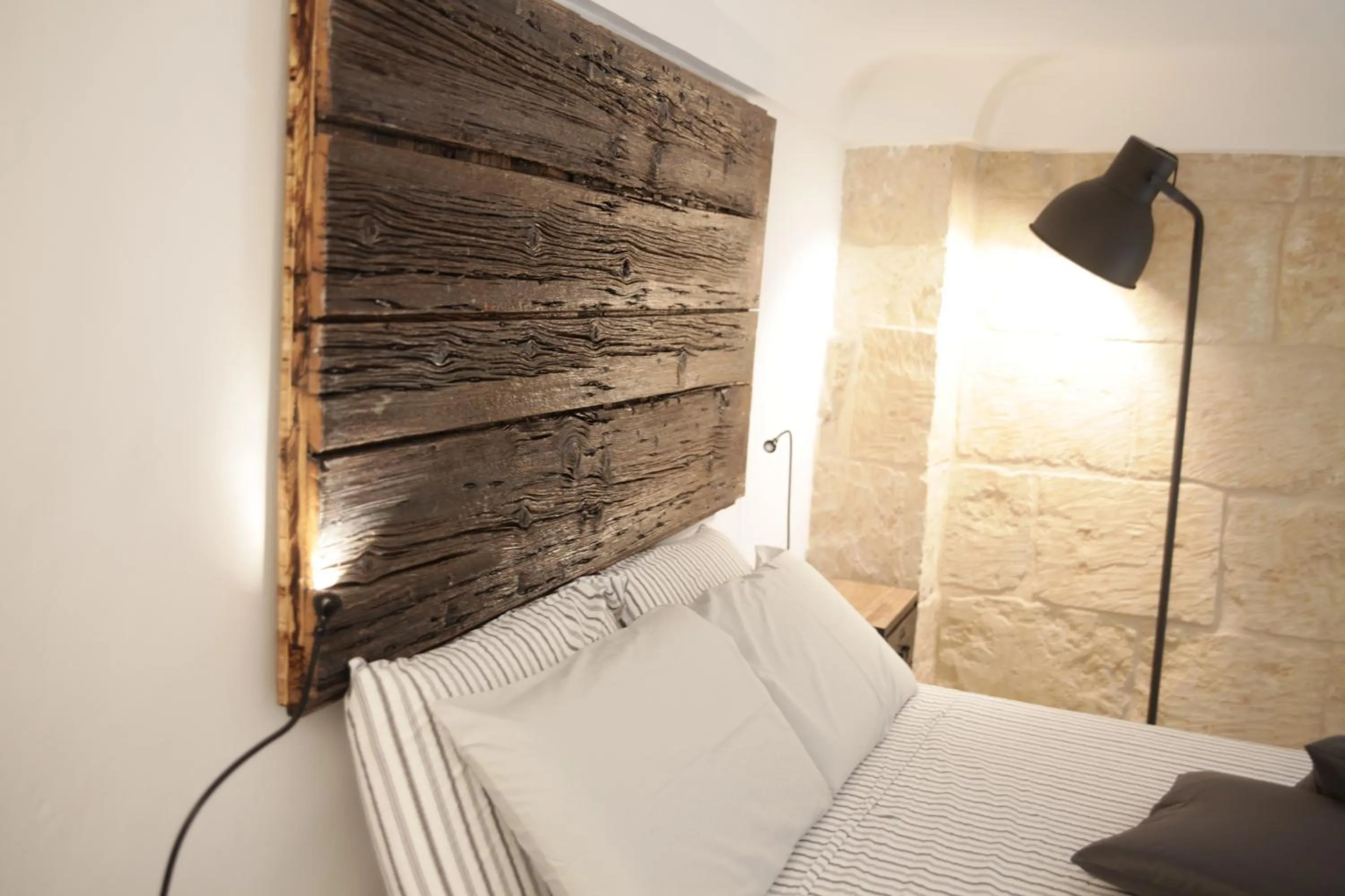 Decorative detail, Bed in Palazzo Mandurino luxury relais