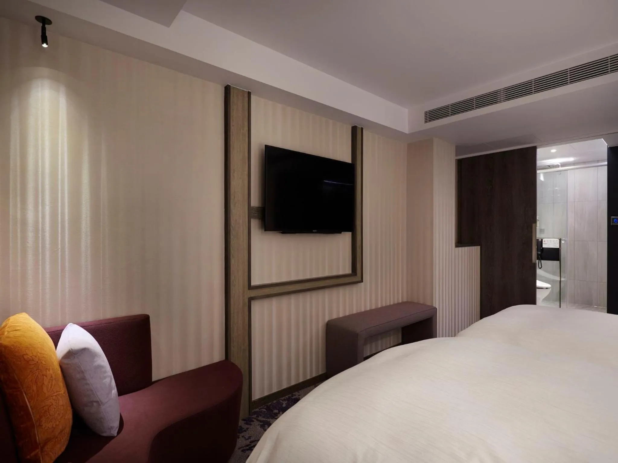 Seating area, Bed in At Home Hotel Ximen