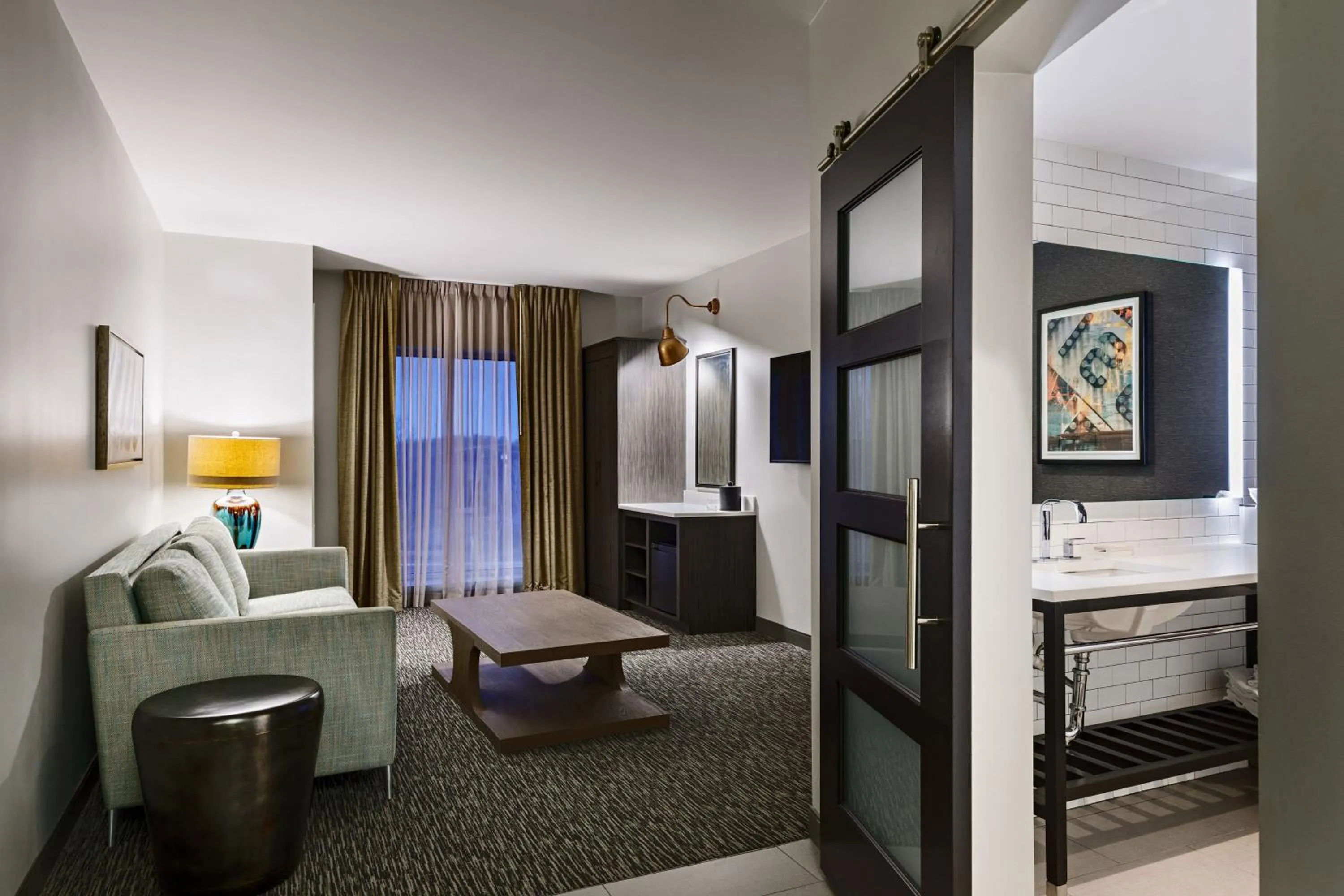 Living room, Bed in The Elmore Hotel, DFW Southlake, a Tribute Portfolio Hotel