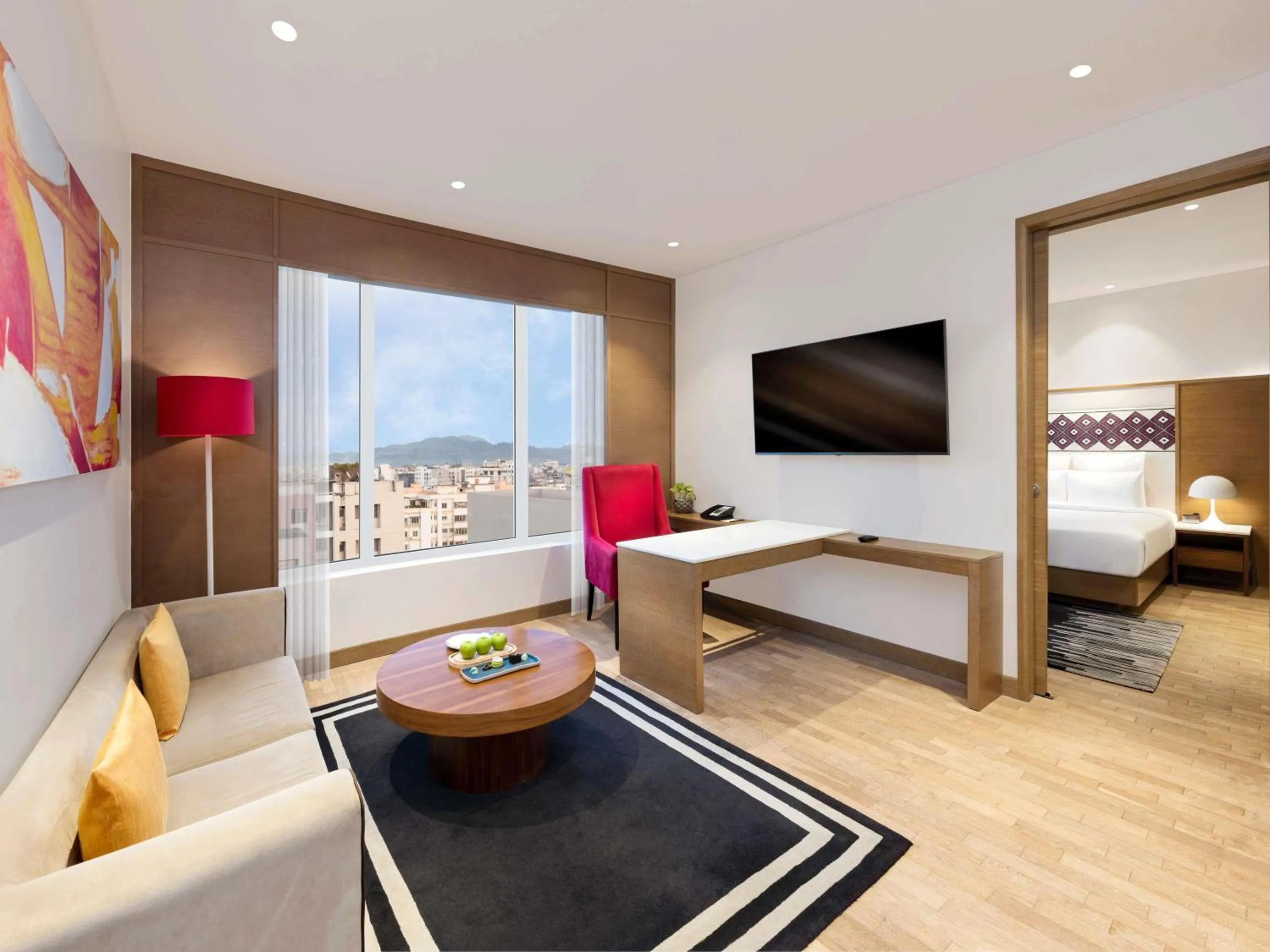 Seating area, Bed in Novotel Guwahati GS Road