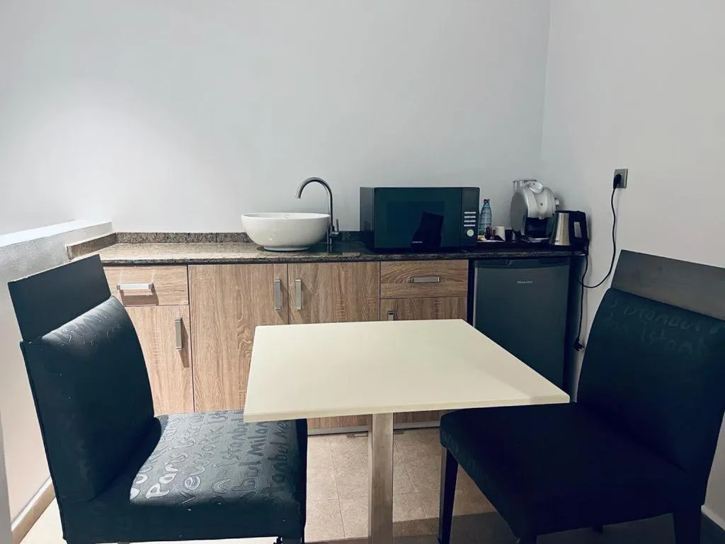 Kitchen or kitchenette in Grand Hotel Central Conakry