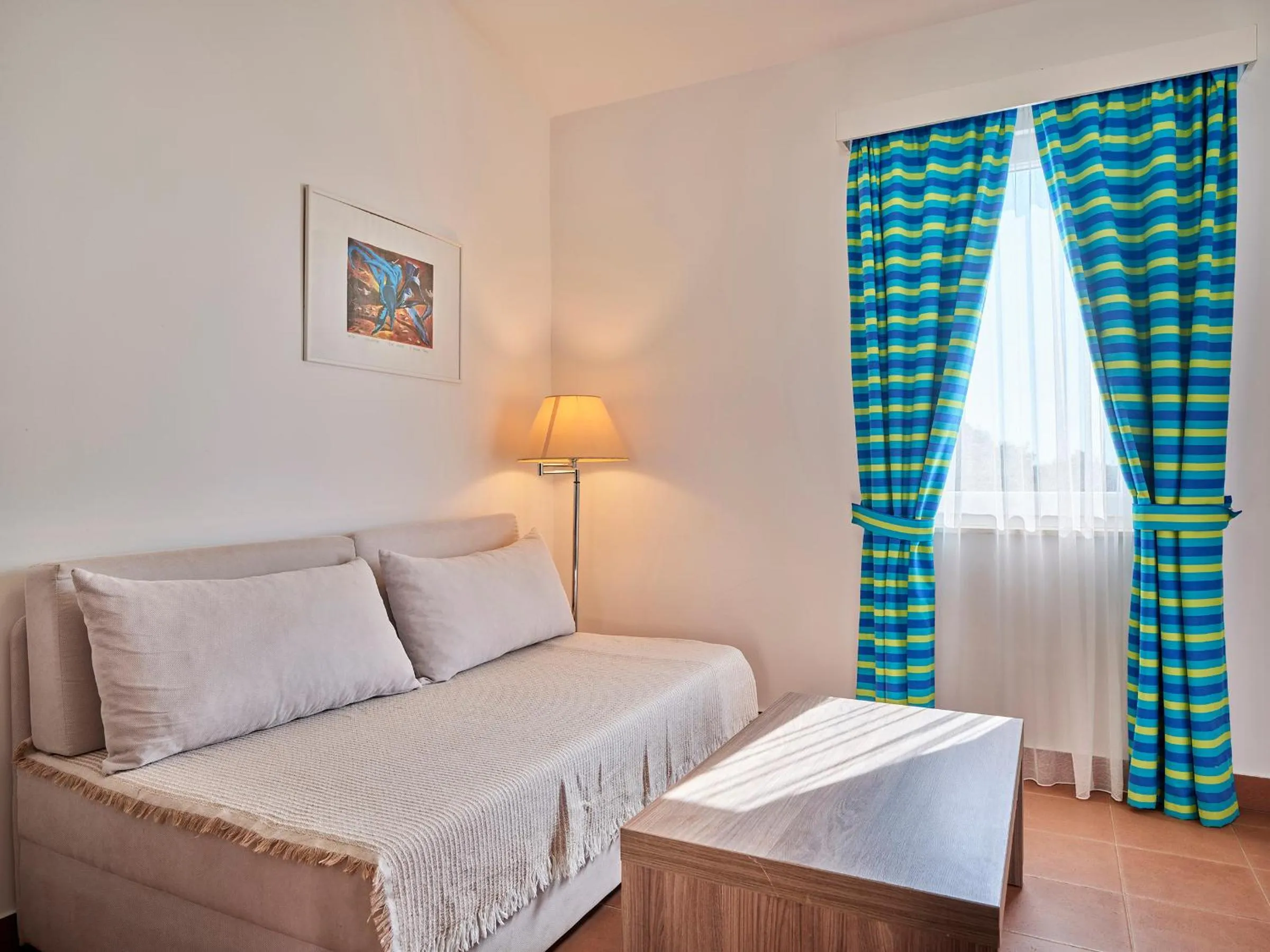 Living room, Bed in Koversada Apartments Naturist Park