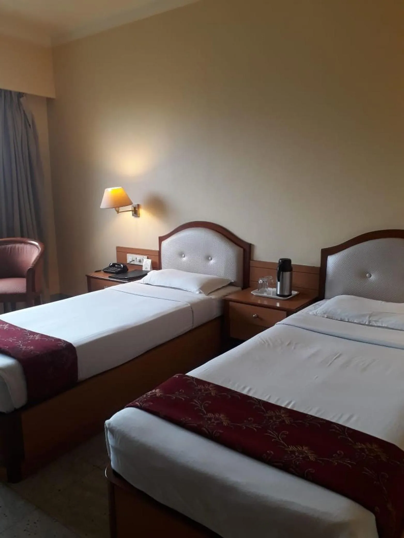 Bed in The Samrat Hotel near Pune Railway Station