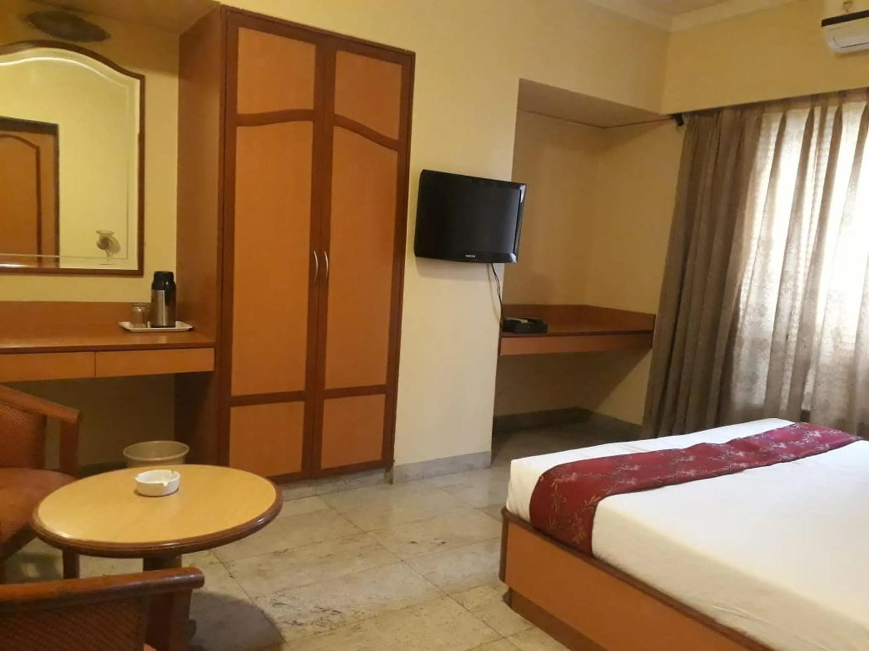 Bed in The Samrat Hotel near Pune Railway Station