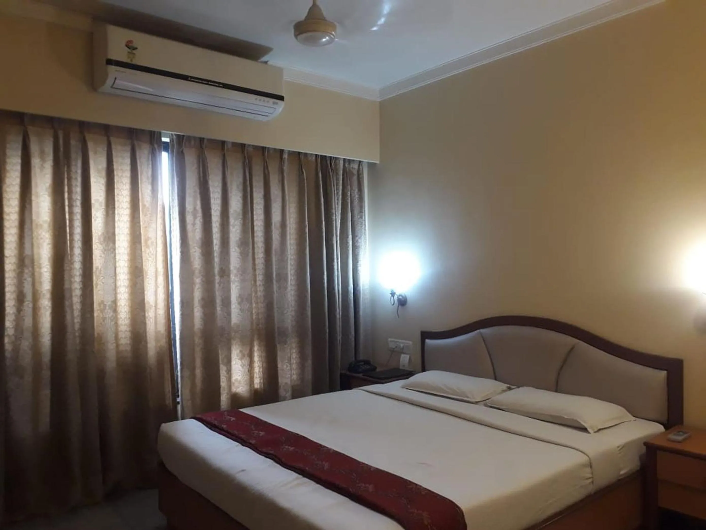 Bed in The Samrat Hotel near Pune Railway Station