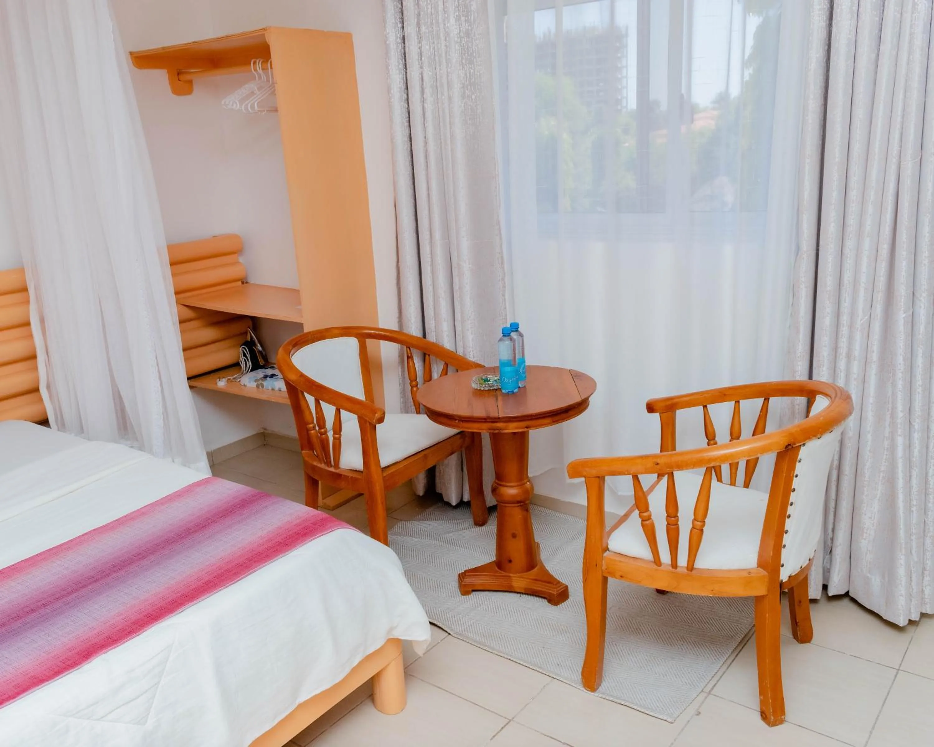 Seating area, Bed in Pinebreeze Holiday Resort