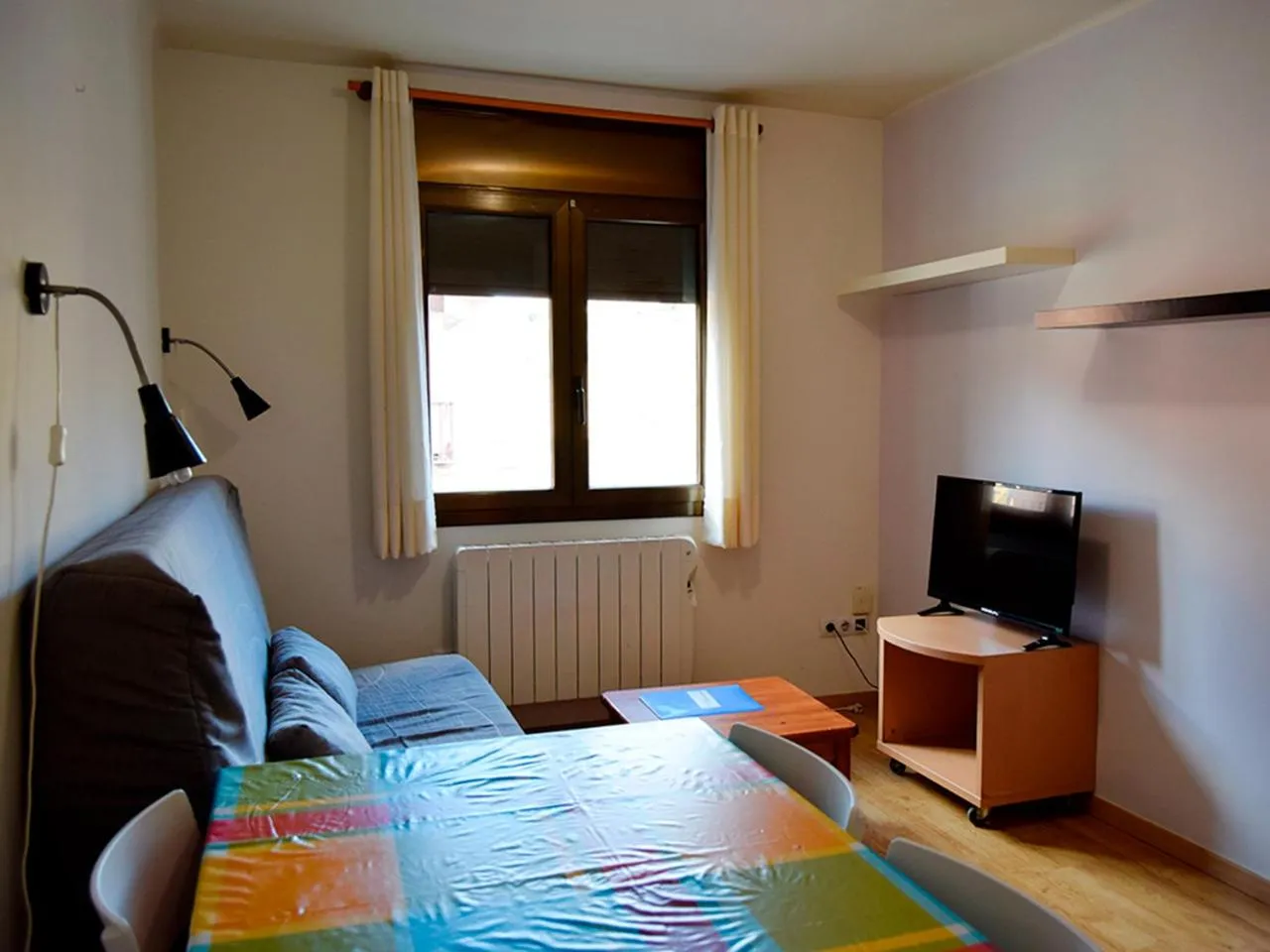 Living room, Bed in Apartamentos Pantebre 3000