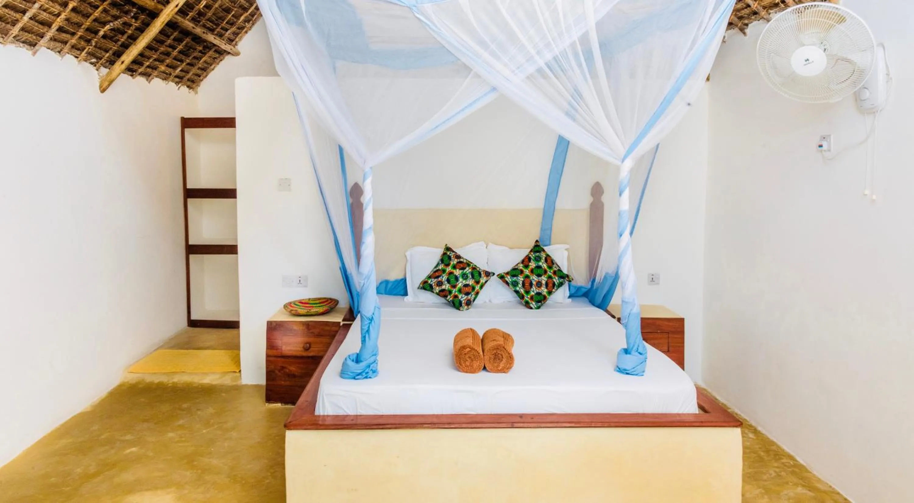 Bed in Mnana Beach Bungalows