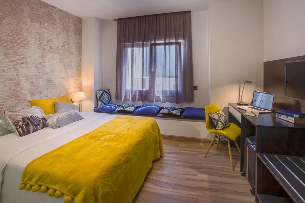 Bed in Gran Marina Suites