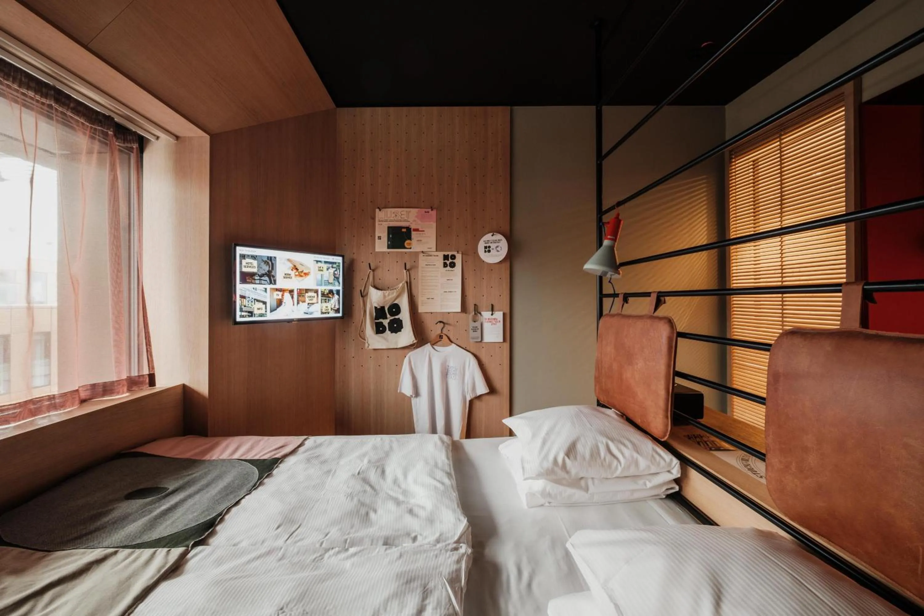 Communal lounge/ TV room, Bed in Hobo Hotel Stockholm