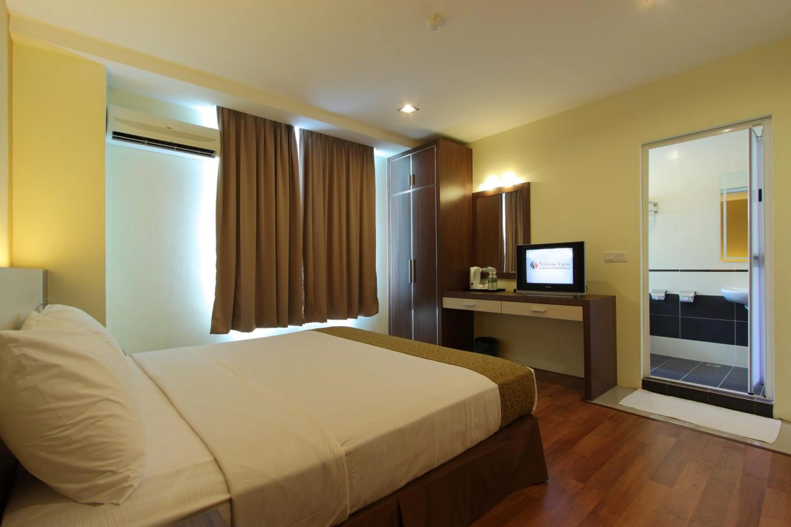 Bed in Seasons View Hotel