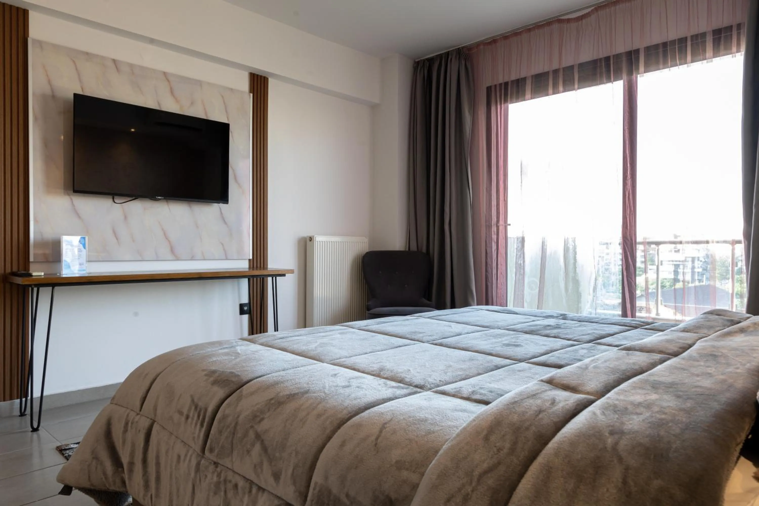 Bed in Limani Comfort Rooms