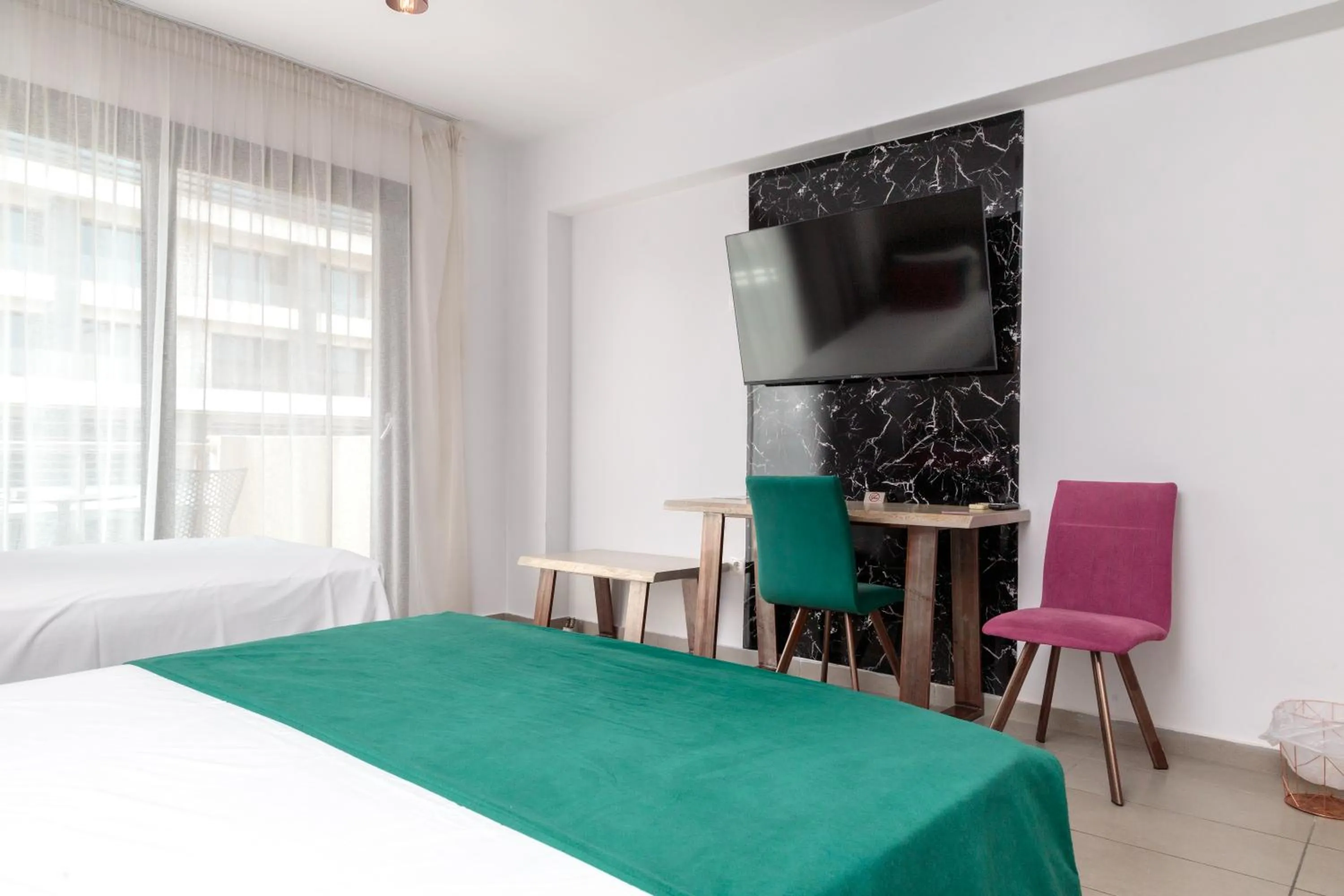 Bed in Limani Comfort Rooms