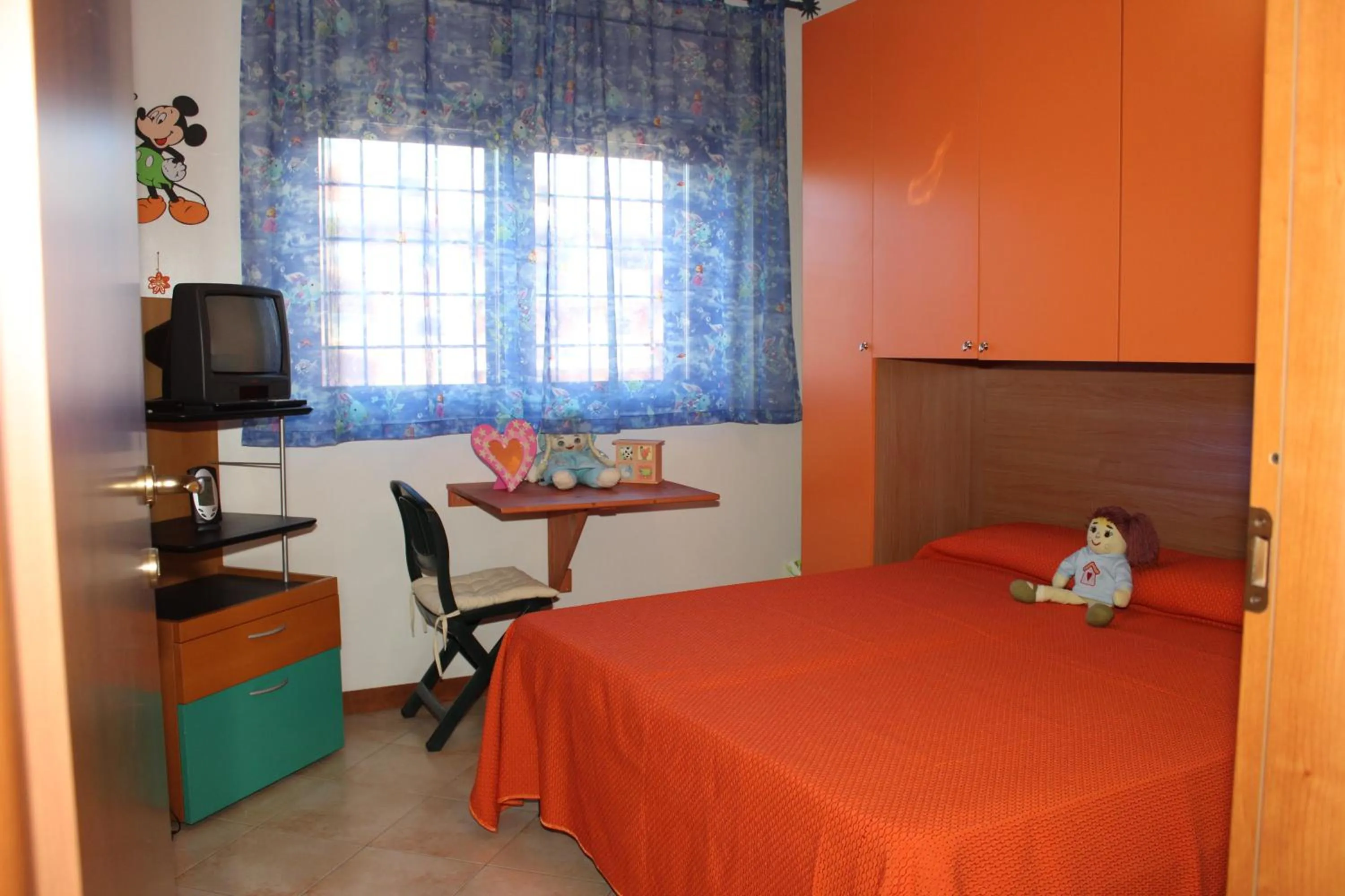 Photo of the whole room, Bed in Casina Carina Carina