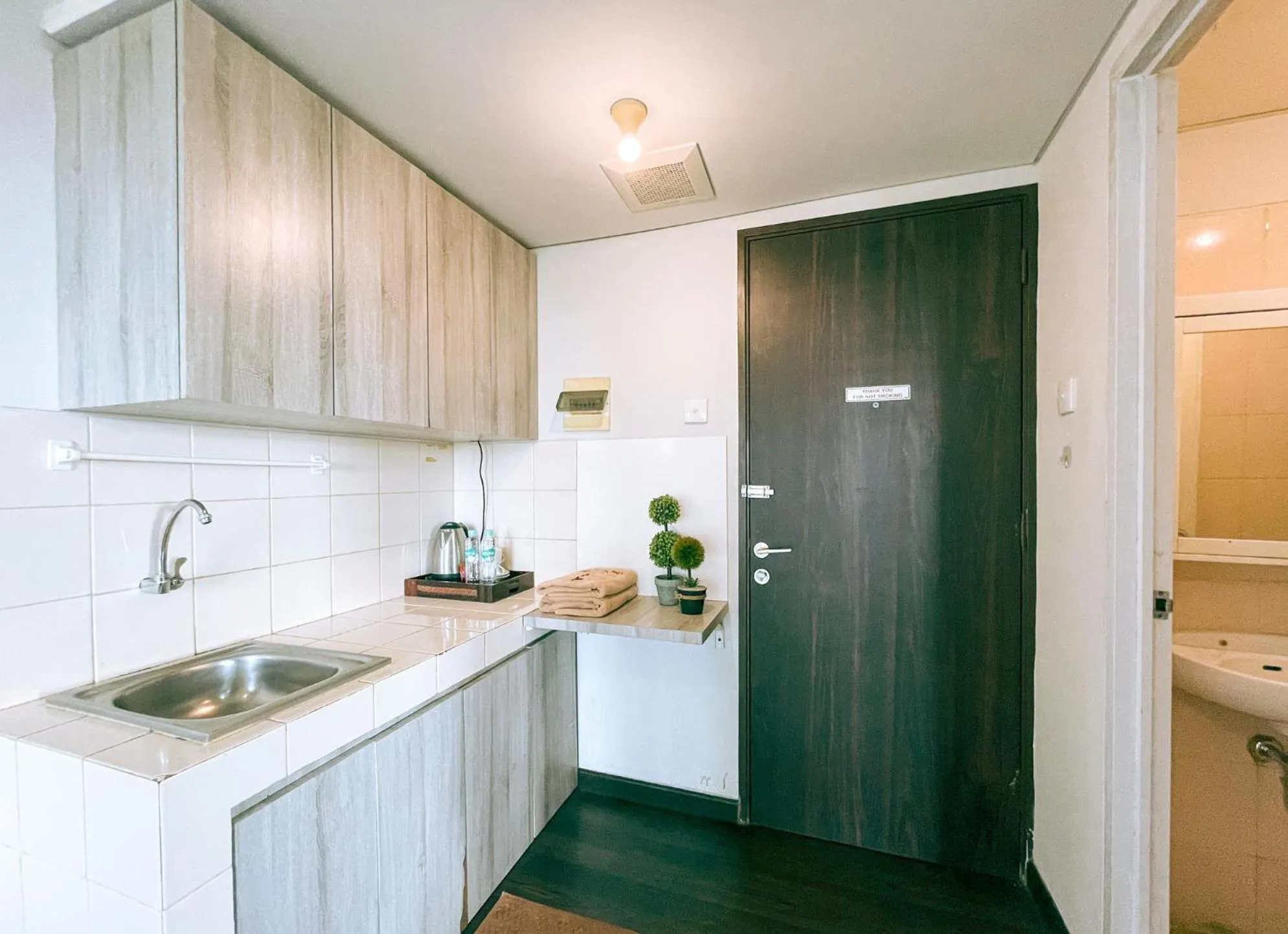 Kitchen or kitchenette in The Satu Stay - Apartemen SGV