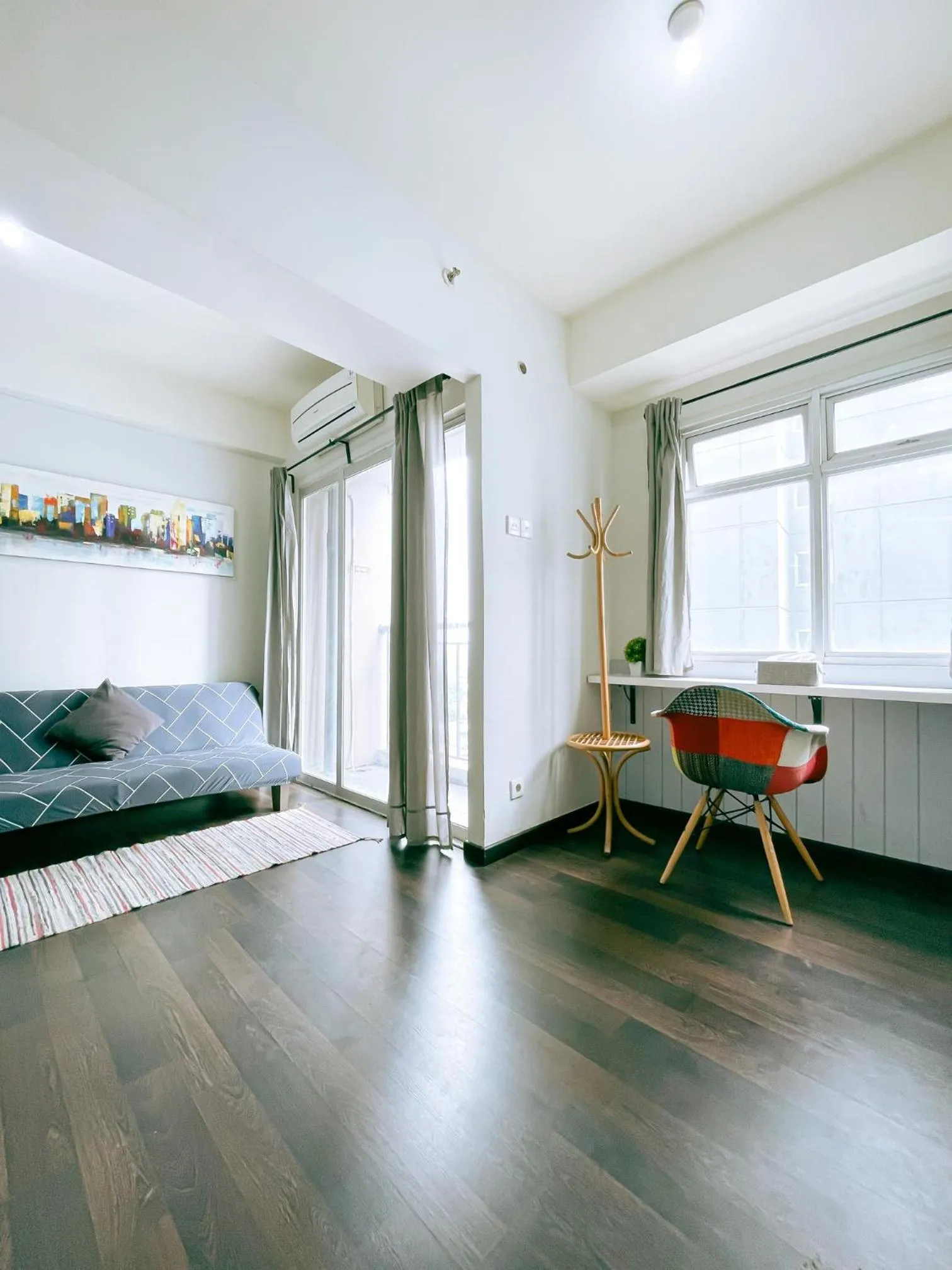 Seating area, Bed in The Satu Stay - Apartemen SGV