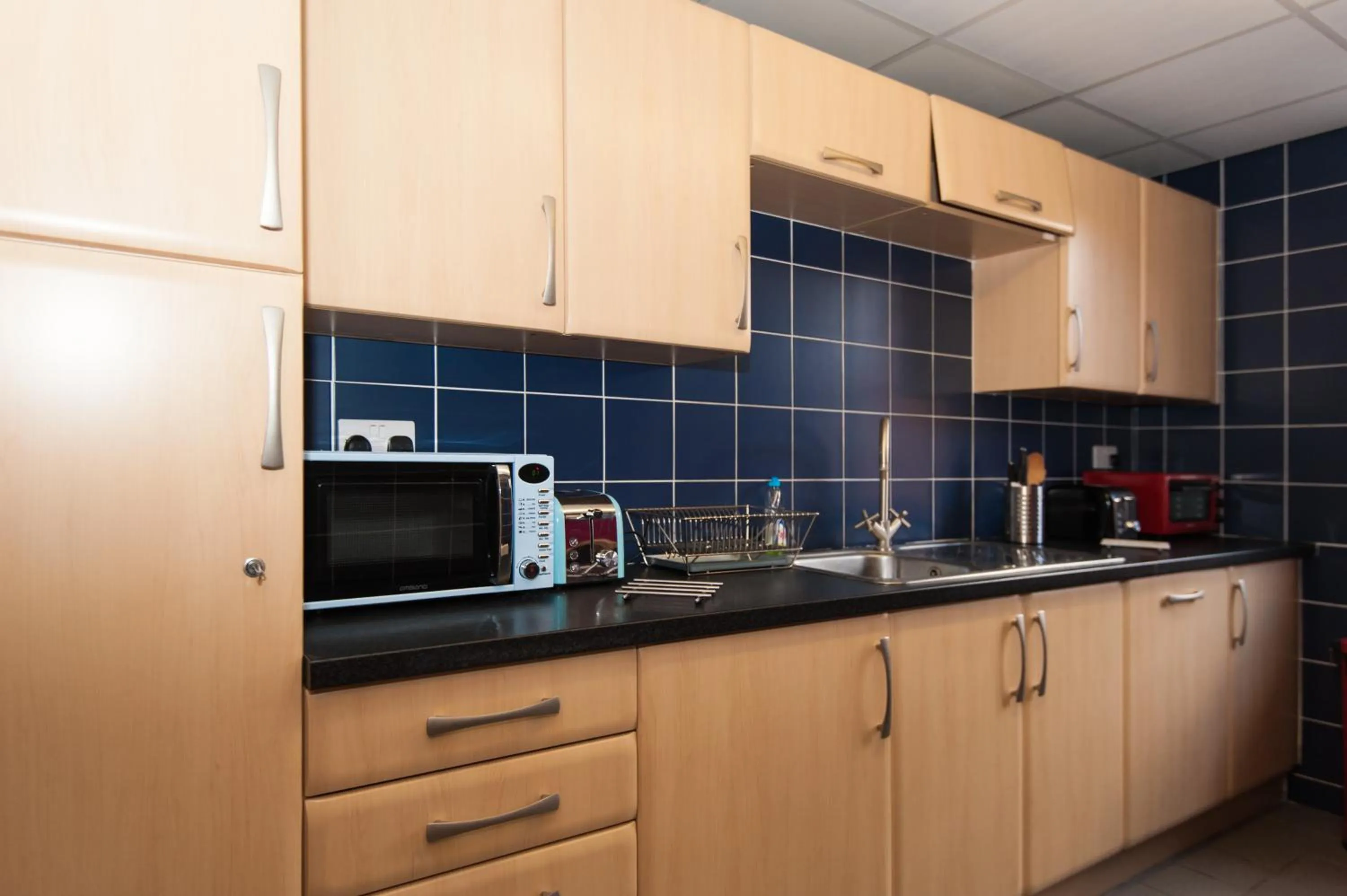 Kitchen or kitchenette in Russell Scott Backpackers Hostel