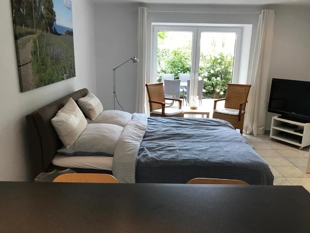 Bed in Ferienwohnung am Mühlenpark
