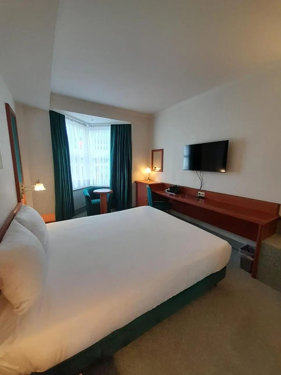 Communal lounge/ TV room, Bed in Hotel Le Dome