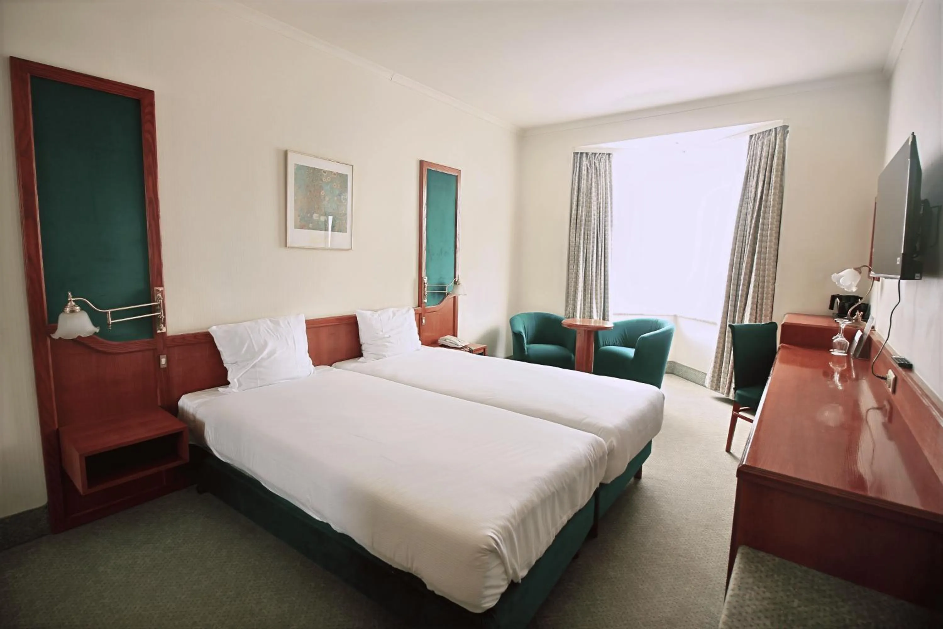 Communal lounge/ TV room, Bed in Hotel Le Dome