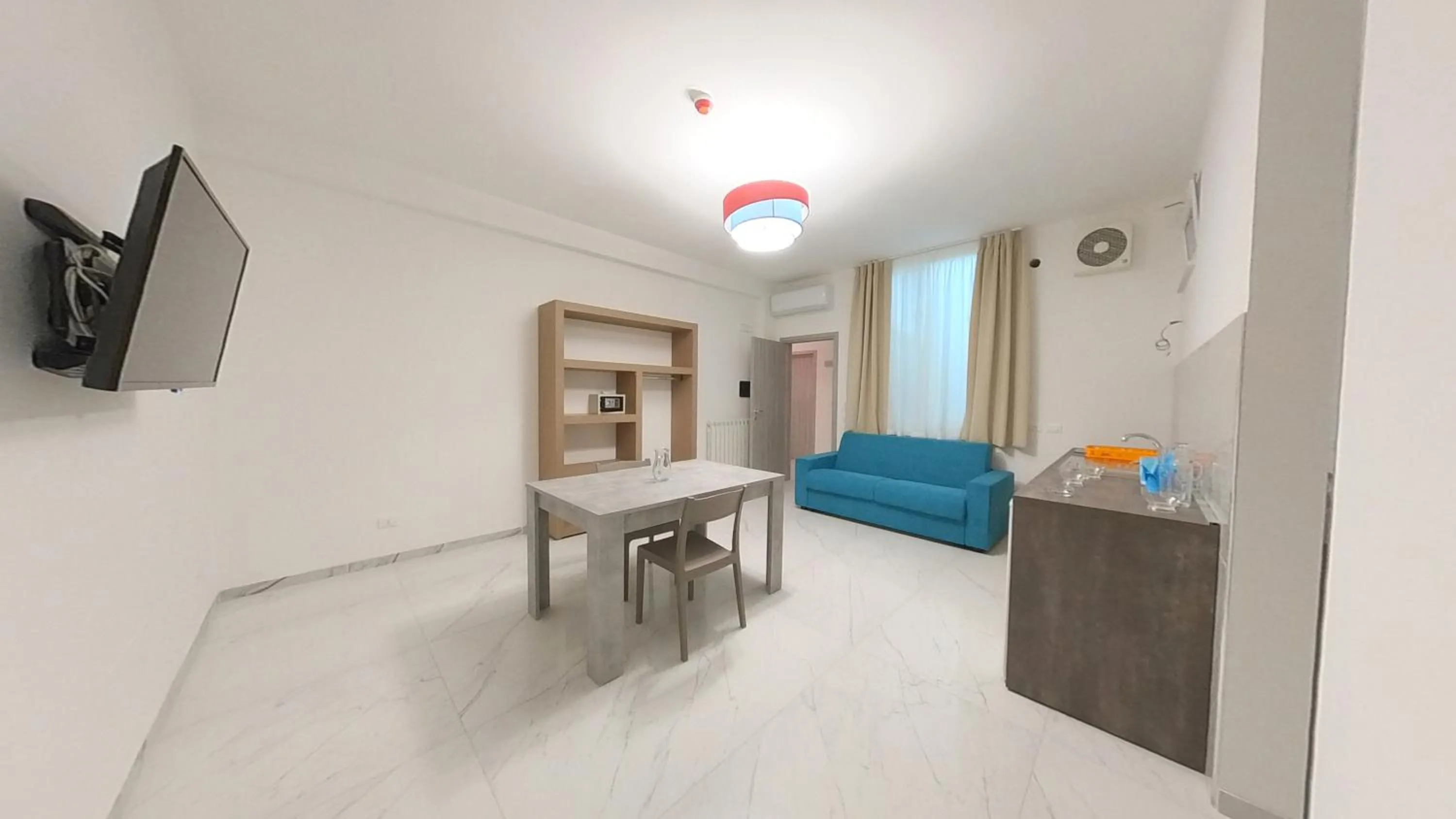 Communal lounge/ TV room in San Cataldo Hotel