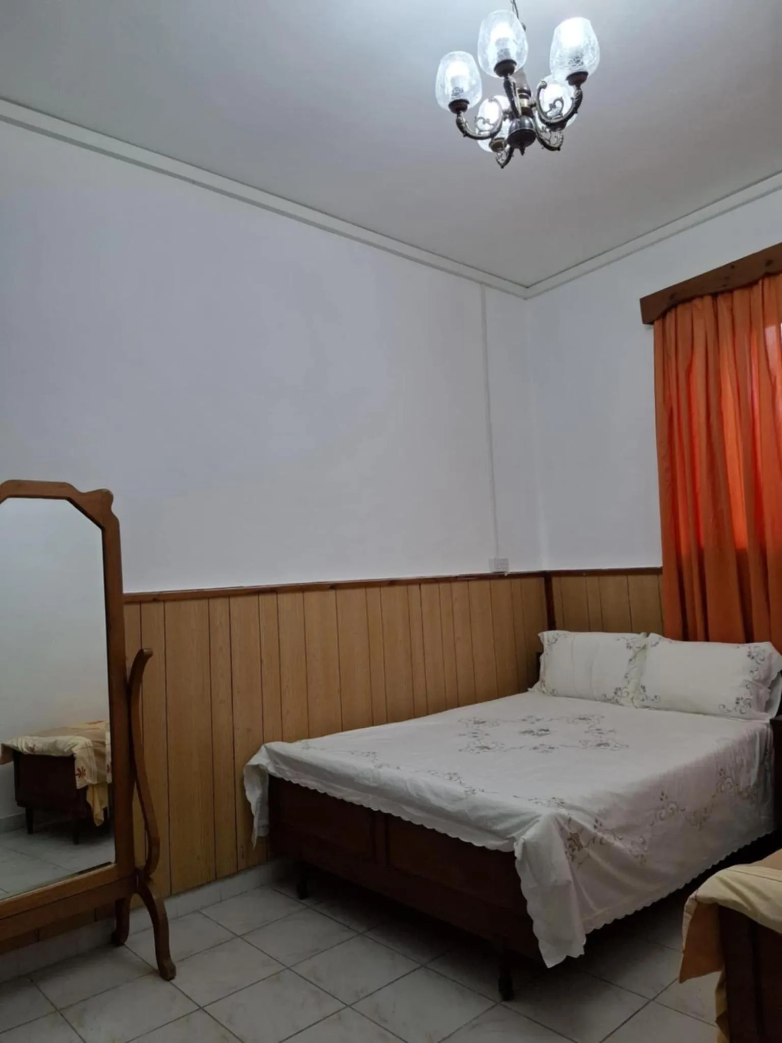 Bed in Mystery Garden Guest House