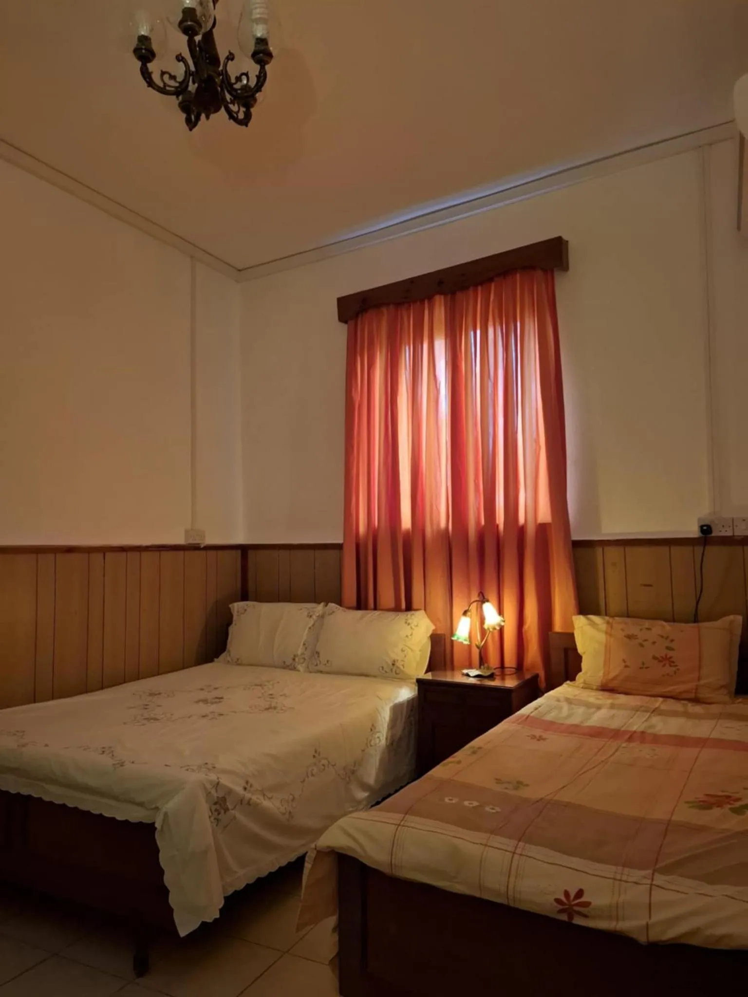 Bed in Mystery Garden Guest House