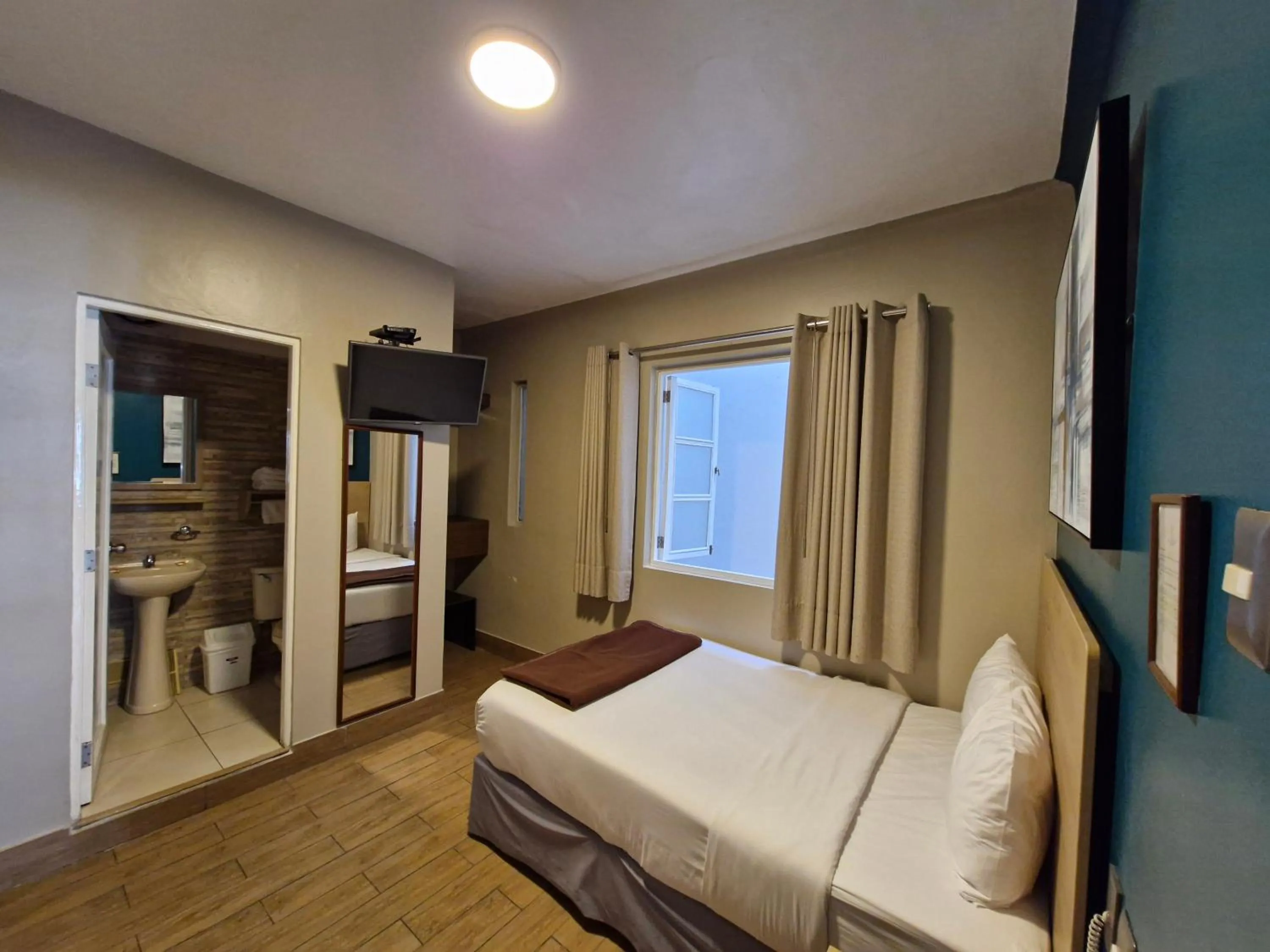 Bed in Residencial Alfa Hotel