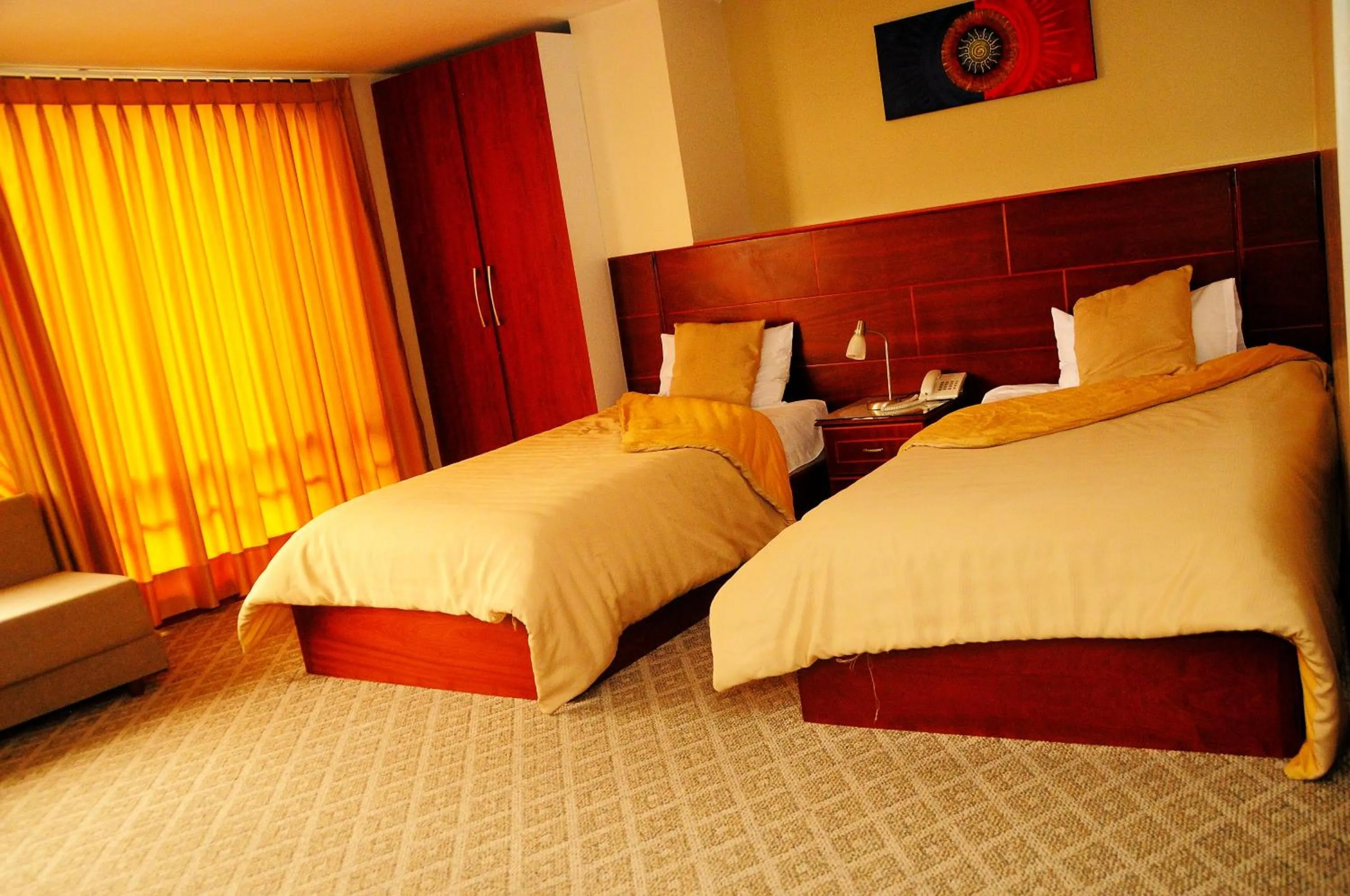 Bed in Colony Inn Hotel