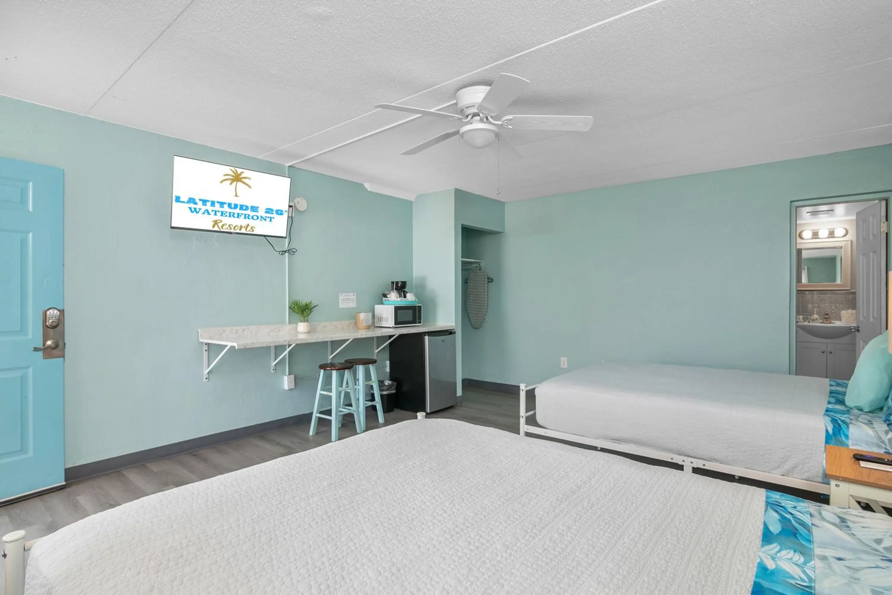 Photo of the whole room, Bed in Latitude 26 Waterfront Boutique Resort - Fort Myers Beach