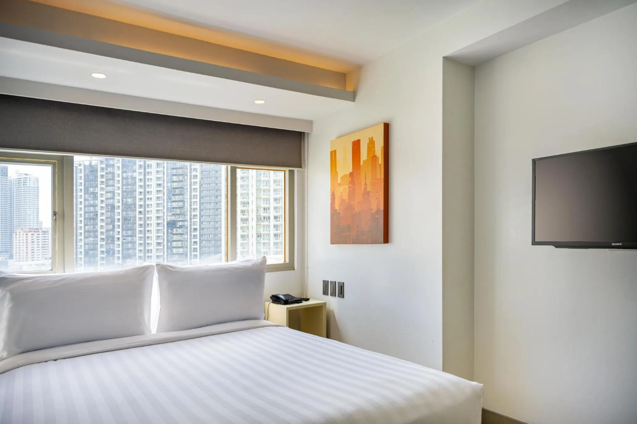Bed in The Mini Suites Eton Tower Makati