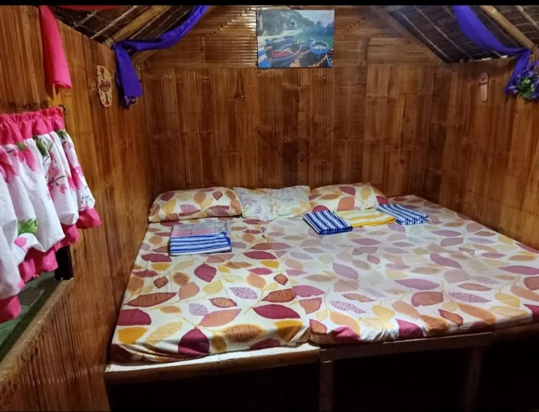 Bed in Moalboal Bamboo Guest House