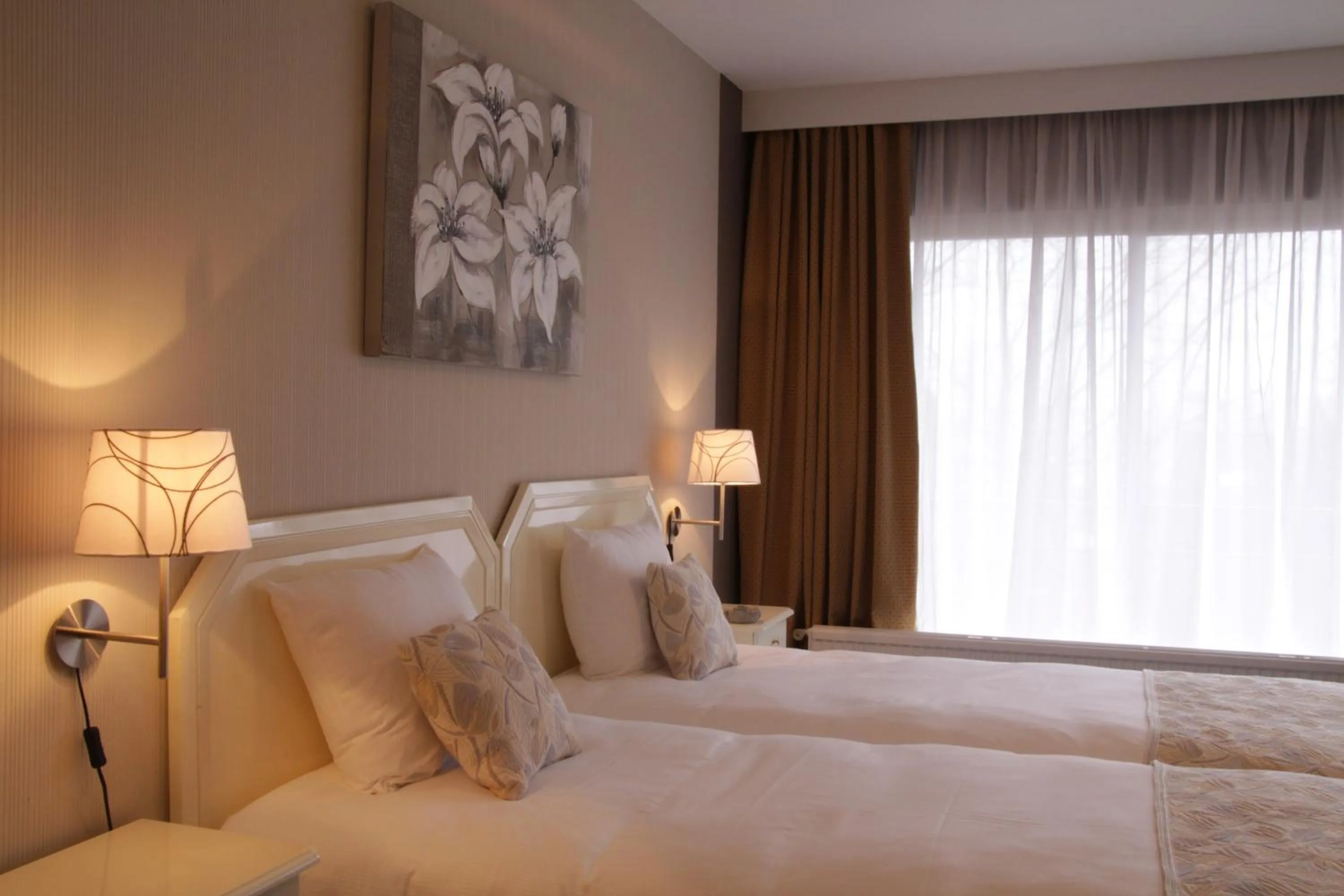 Bed in First Euroflat Hotel