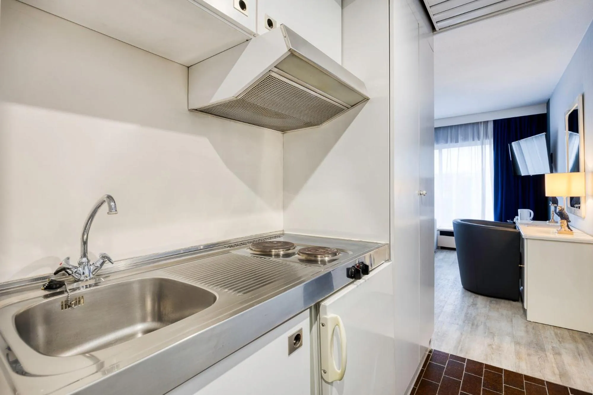 Kitchen or kitchenette in First Euroflat Hotel