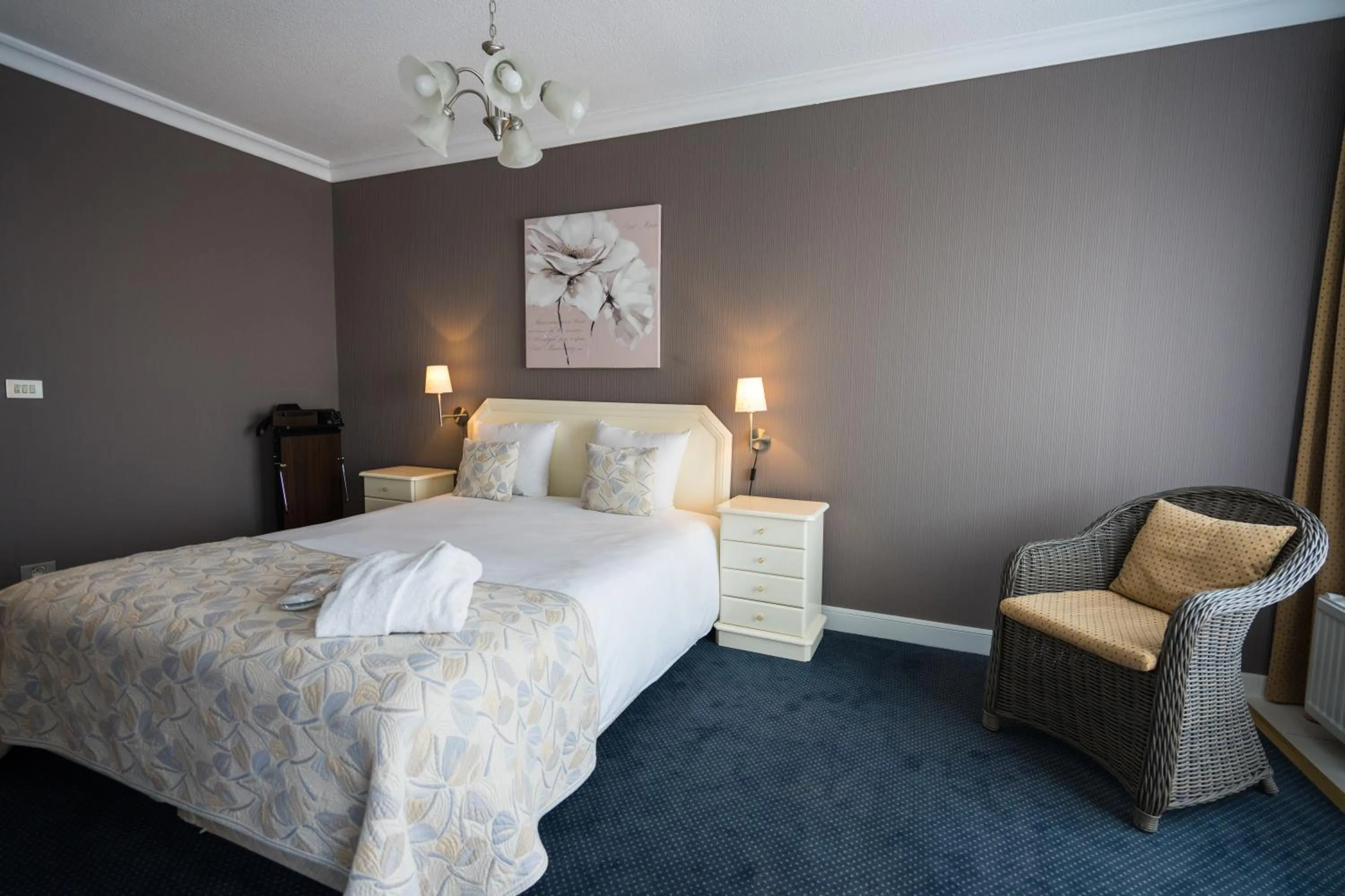 Bed in First Euroflat Hotel