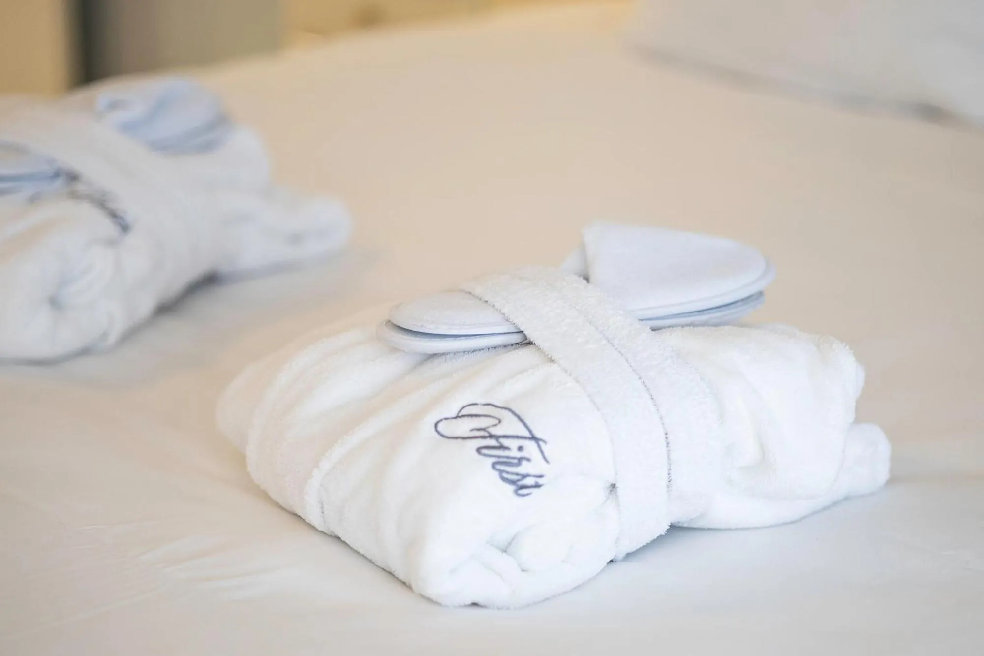 Bed in First Euroflat Hotel