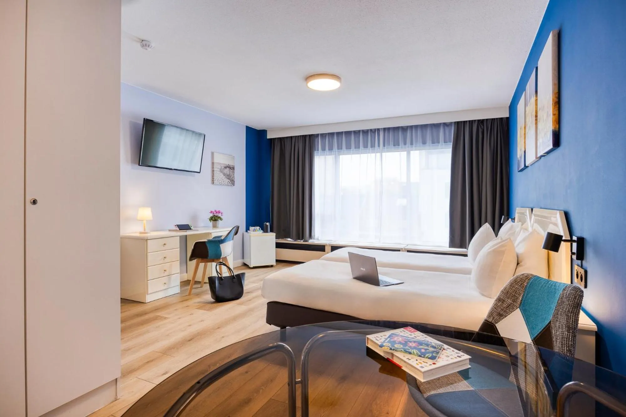 Bed in First Euroflat Hotel