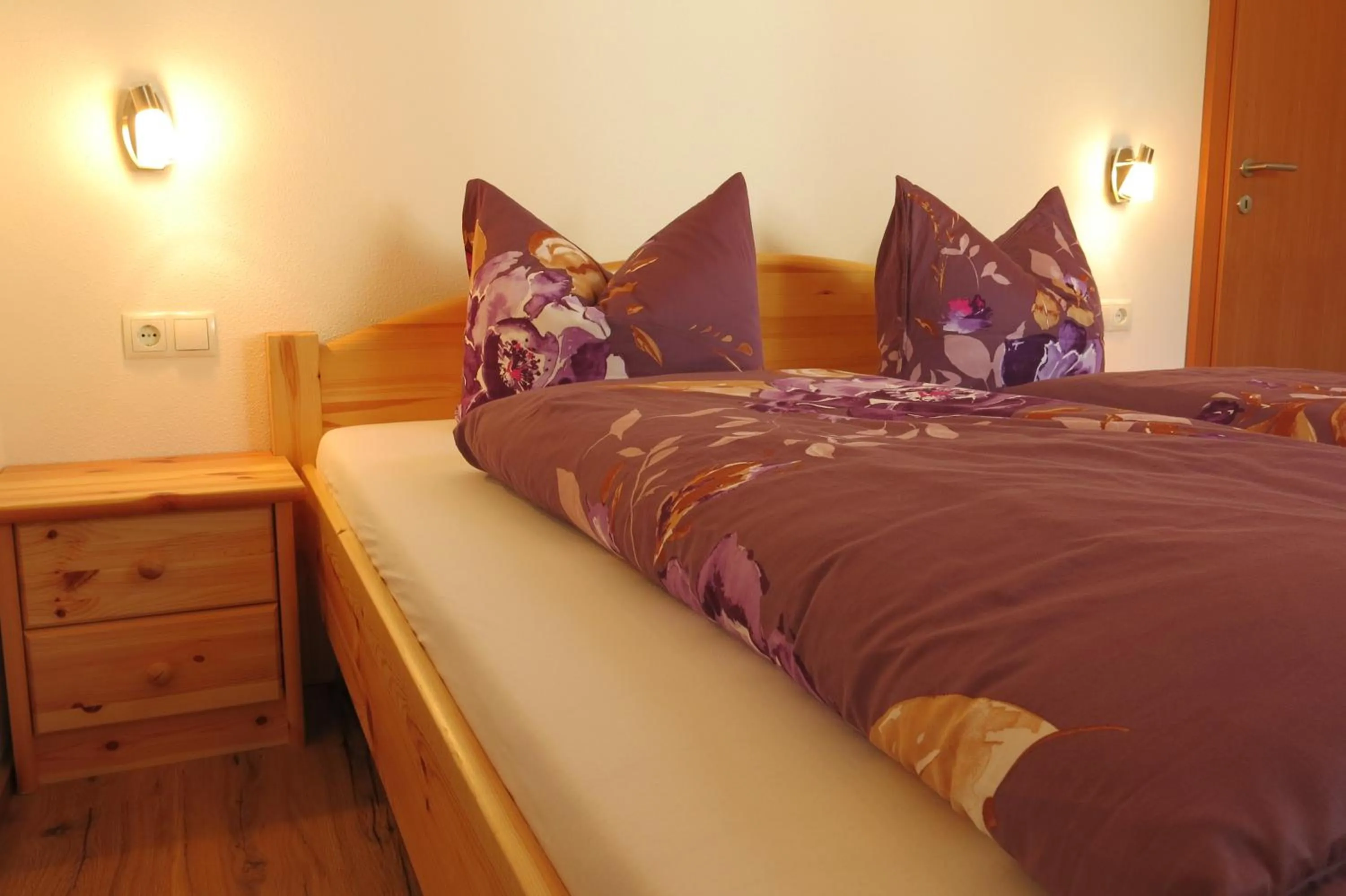 Bed in Ferienwohnung Kainer