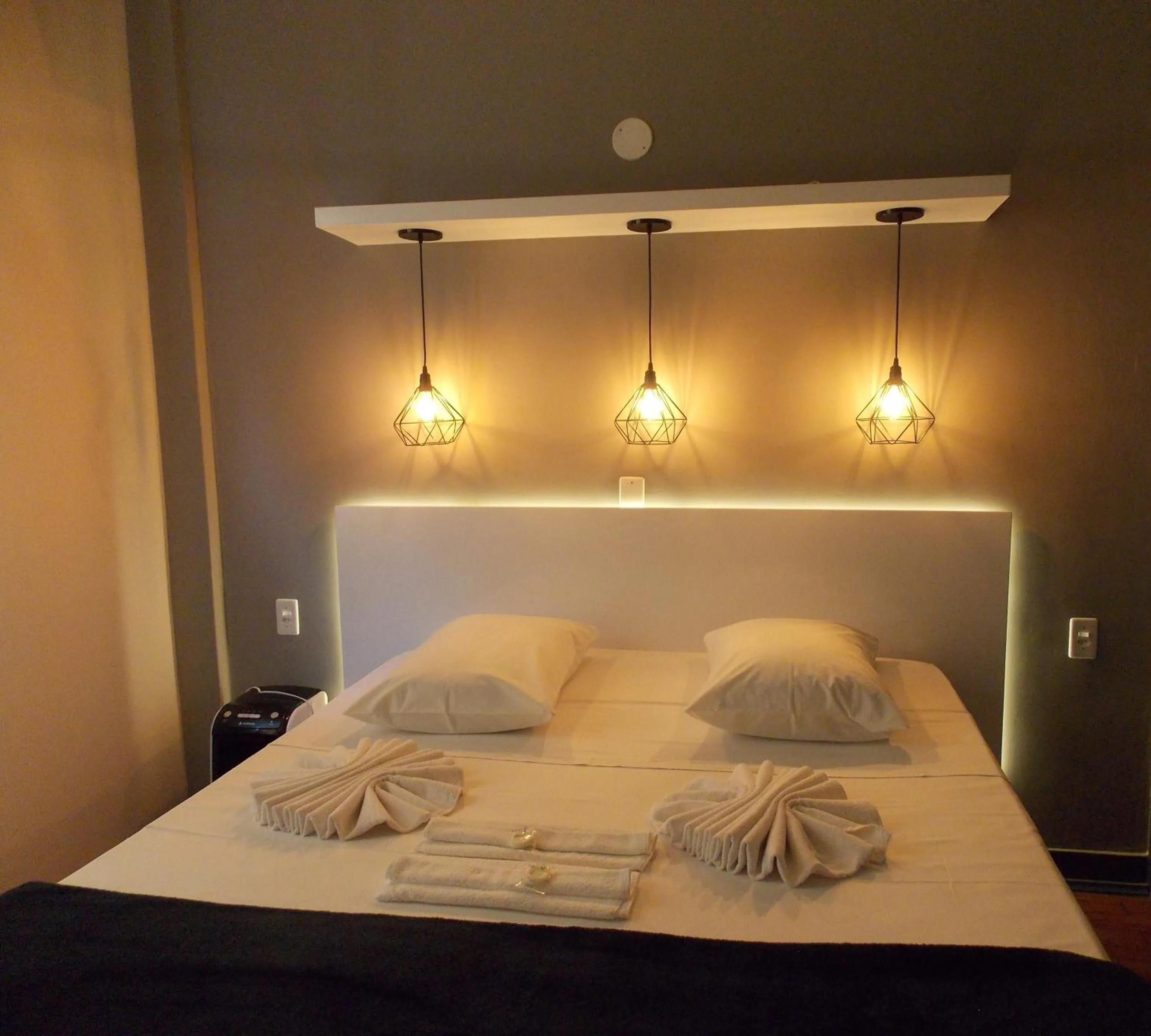 Decorative detail, Bed in MOVA Hotel D'oeste - Localizado em frente a Praça Principal da Cidade, na área Central - Pé na Praça